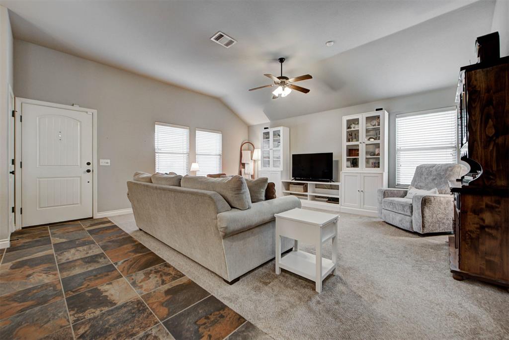 Welcome to this inviting 3-bedroom, 2-bath home with a desirable split floorplan and flexible living spaces. Enjoy relaxing on the covered front and back patios, perfect for morning coffee or entertaining. The kitchen features quartz countertops, a travertine backsplash, a convenient eating area, and a large pantry for extra storage. Throughout the home you’ll find beautiful mixed woodwork and an abundance of natural light. The primary suite includes a ceiling fan and walk-in closet with custom shelving that provides great organization.  A versatile FLEX SPACE offers endless possibilities—ideal for a home office, play area, sitting room, or hobby space. Move-in ready and full of charm, this home is ready for its next owner to enjoy!