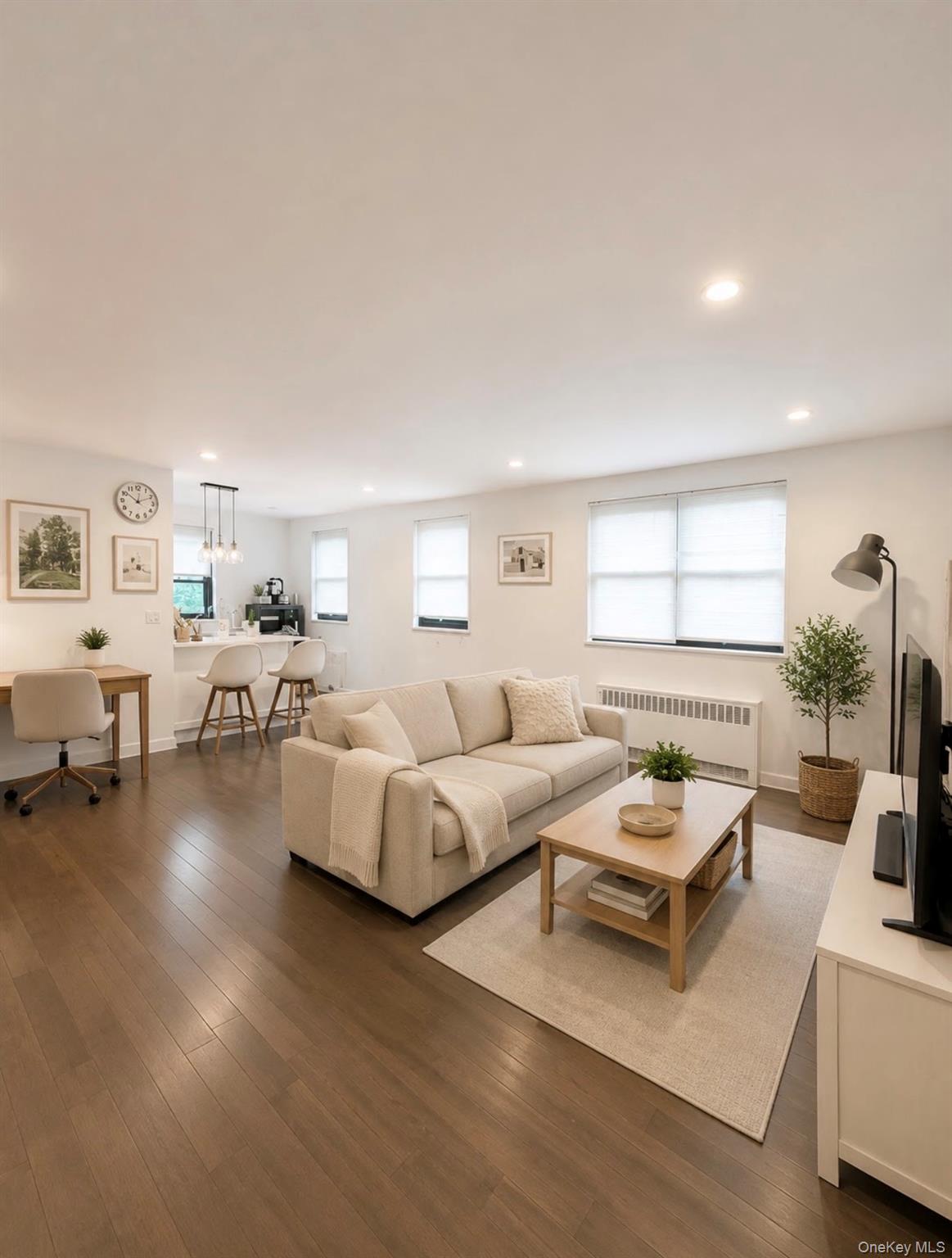 Bright and spacious corner unit featuring 2 large bedrooms, bonus attic space, new flooring throughout, and multiple windows for abundant natural light and cross ventilation. Renovated kitchen with stainless steel appliances and in-unit washer/dryer. Maintenance includes everything except electricity!Excellent commuter location near Q16, Q76 and QM20 express bus to Manhattan, with easy access to Clearview Expressway and Cross Island Parkway. LIRR is less than 10 minutes by car.