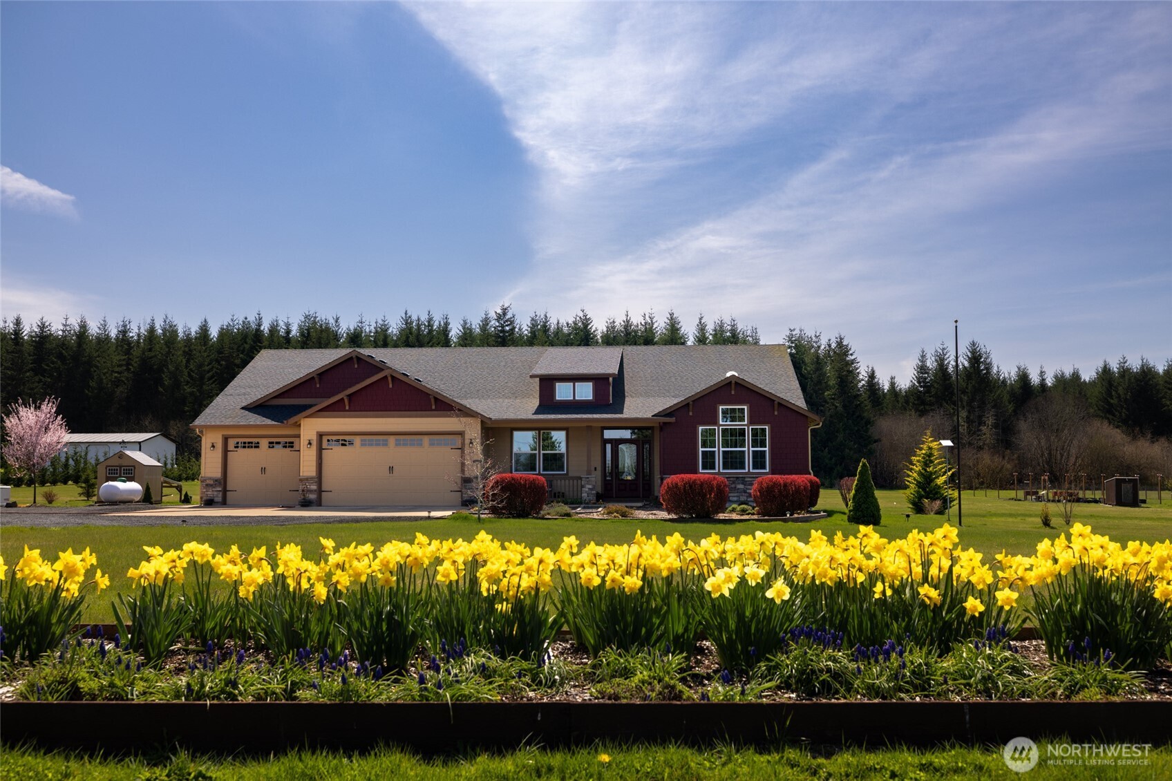 Stunning Adna area home sits on 5 manicured acres! This grand custom kitchen is going to please any chef in the house, with custom cabinets w/soft close drawers, enormous island, an abundance of counter space & storage. All this opening up to a large living room & dining room area w/an easy flow out to the covered porch area. Home has 3 bedrooms an office, built in bookshelves, large walk in pantry, vaulted ceilings & commercial grade laminate flooring. The primary has a custom shower, walk in closet & a make-up sitting area. The exterior is just as grand w/a large shop, outbuildings, heat pump, garden area & a basketball court. A ground mounted 10,220w solar panel array. 22Kw standby generator and so much more.