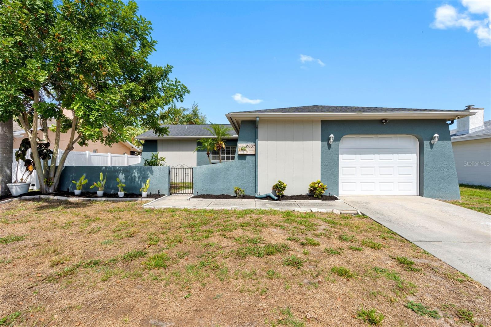 Opportunity knocks with this well-maintained home in desirable Palm Harbor! This home features newly remodeled bathrooms (2025), stylish vinyl flooring, and numerous updates for peace of mind, including a plumbing system update (2022), water softener (2022), HVAC system (2020), and roof replacement (2019). The bedrooms feature walk-in closets for added storage and convenience. Additional highlights include a screened-in porch overlooking a spacious, vinyl fenced-in backyard with a deck, perfect for entertaining or relaxing. Currently zoned for top-rated Palm Harbor schools, including Palm Harbor University High School. No HOA and no flood insurance required!