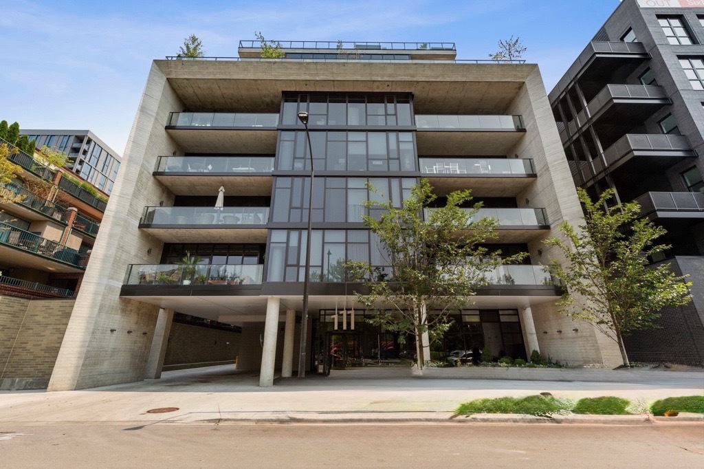 Welcome to your dream home in one of Chicago's most vibrant neighborhoods, the West Loop. Sold furnished, this three-bedroom plus den, three and a half bath condo combines modern luxury and comfort with the industrial-chic character the neighborhood is known for.  Step inside to soaring ceilings, wide-plank hardwood floors, and Italian design throughout. The open-concept living area features spacious living and dining areas and a large chef's kitchen with high-end stainless steel appliances, quartz countertops, and a spacious island. The primary suite is a quiet retreat with two large walk-in closets and a spa-like bathroom with a dual vanity, soaking tub, and glass-enclosed shower. Two additional ensuite bedrooms provide ample space for family or guests. The den has a custom wood door, and is ideal for a media room, workout space, or a quiet home office. Enjoy city views from your private balcony and close it down with motorized black-out shades in bedrooms. This condo has in-unit laundry, 2 garage parking spaces available for purchase, and smart-home features, every detail has been designed for comfort and convenience.  Located just steps from world-class dining, Fulton Market, Randolph Street's "Restaurant Row," boutiques, galleries, parks and a dog park-this condo truly puts the best of the West Loop at your doorstep.