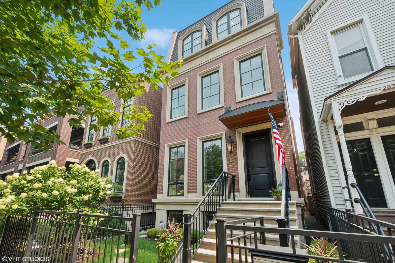 This newer construction Lincoln Park showpiece blends timeless architecture with modern sophistication. Offering 6 bedrooms, 5.5 baths, 3 outdoor spaces, and 5,200 sq. ft. of living space. Finishes include 3 fireplaces, wide-plank oak floors, soaring 10 foot ceilings, custom millwork, designer finishes, 3 bars, a Savant smart home system, automatic shades, heated lower and bathroom floors, irrigation, and a five-camera security system. The main level flows from a formal living room with fireplace to an elegant dining area, then into a chef's kitchen with marble countertops, large island, pro-grade appliances, and butler's pantry-opening to a bright family room with built-ins and a second fireplace. Upstairs, the second level presents 3 large ensuite bedrooms, including a luxurious primary suite with two walk-in closets and a spa bath with radiant heat floors, separate vanities, oversized steam shower, water closet, and soaking tub. The third floor offers a bonus room with wet bar, a 4th bedroom, and a 17' x 30' rooftop terrace with covered lounge. The lower level is built for entertaining with heated floors, 10 foot ceilings, a full wet bar with two wine refrigerators, 2 bedrooms, and a bath. Three exceptional outdoor spaces include a heated bluestone patio with fireplace, a brand-new garage rooftop deck with heaters, cooler, and TV, and a third-floor partially covered terrace with TV. A snowmelt system automatically clears the front steps and patio for effortless winters. Located in a prime school district and just steps from Jonquil Park, boutique shops, acclaimed dining, and the L, this home delivers turnkey Lincoln Park luxury.  SOME PHOTOS HAVE BEEN VIRTUALLY STAGED TO SHOW OTHER DESIGN OPTIONS, NO FINISHES WERE CHANGED, JUST FURNITURE.