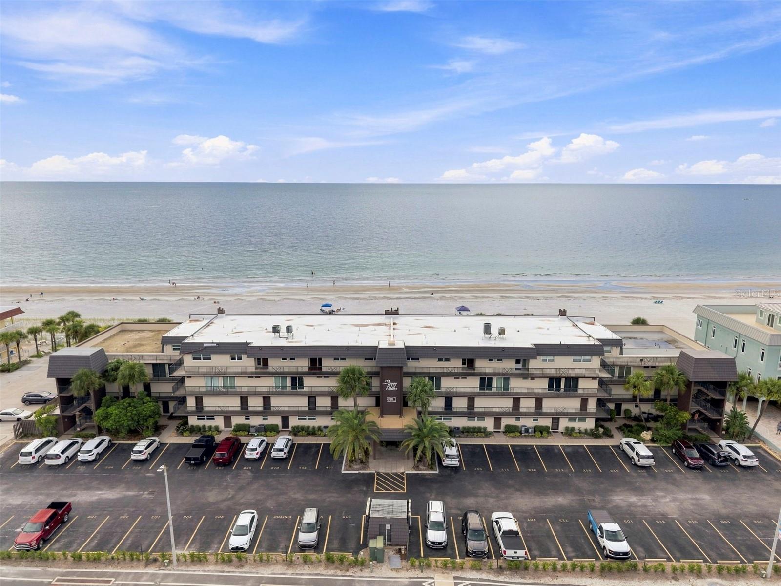 Welcome to Happy Fiddler at the Narrows, where coastal luxury meets unbeatable versatility. Perched on the top floor at 60 Gulf Blvd (#402), this premier 1,795-square-foot penthouse delivers rare 360-degree views sweeping across both the Gulf of Mexico and the Intracoastal Waterway. Designed for seamless coastal living, the layout features a light-filled great room and an open-concept kitchen built for entertaining. A thoughtful split-bedroom floor plan ensures total privacy for guests, while the expansive primary suite serves as a personal sanctuary—complete with captivating beach vistas, an ensuite bath, and a deep walk-in closet. Sold with all furnishings included and currently operating as an active vacation rental with immediate income potential, this property is completely turnkey ready. Building highlights include a heated pool, private bayside fishing dock, and direct access to sugar-white sands, placing you just steps from top local dining and boutique shopping in Indian Rocks Beach. Newer windows and doors installed 2018, permit on file, new metal roof 2024, community and Milestone on file Whether you are expanding your investment portfolio or searching for a private waterfront retreat, this penthouse delivers the quintessential Florida lifestyle. Shown by appointment only. Active STR with weekly rentals, 100% passive investment with managment in place.