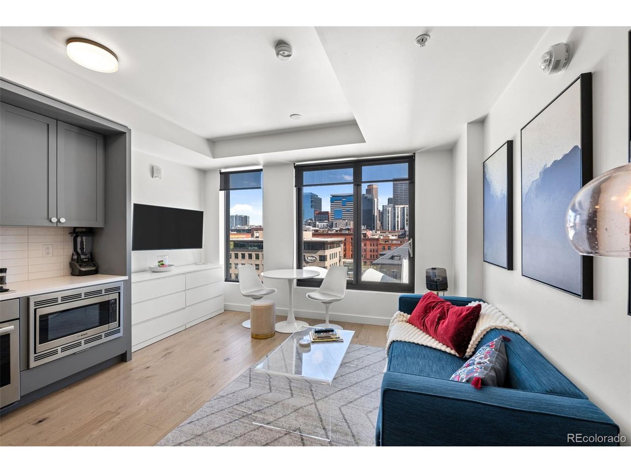 From the moment you open the front door and get the first peek of the historic Union Station sign, you know this is a veryspecial home. This seventh-floor, fully furnished, studio home boasts expansive windows that capture morning light and offer the stunning Union Station, cityscape and LoDo views that the Coloradan is famous for. You realize that the energy and atmosphere of Lower Downtown is right out your living room window, and your front door.  The clean lines of the kitchen offer stainless steel Bosch appliances with a gas cook top, soft-close cabinets and quartz countertops. The kitchen as well as the wide-open living area all bask in great light and incredible views. This is condo is completely ADA compliant swell. Life at The Coloradan allows access to premium amenities, such as the 18th-floor lounge with incredible panoramic views, a year-round outdoor pool and hot tub, a cozy fire pit and grilling area. The fully equipped fitness center and the library on the mezzanine level provides a convenient fitness boost or quiet escape for reading or remote work. The ground floor offers a variety of retail options, including the Kaffe Landskap coffee shop, Sweetgreen, Blo Blow Dry Bar, and the Union Hall Arts & Culture Center. Being located adjacent to Union Station, The Coloradan is just steps away from the train to DIA, numerous fine dining options and the convenience of Whole Foods right across the street. In walking distance to Coors Field, Ball Arena, Empower Stadium, theater venues and beyond, 722 has everything and more to welcome you home!