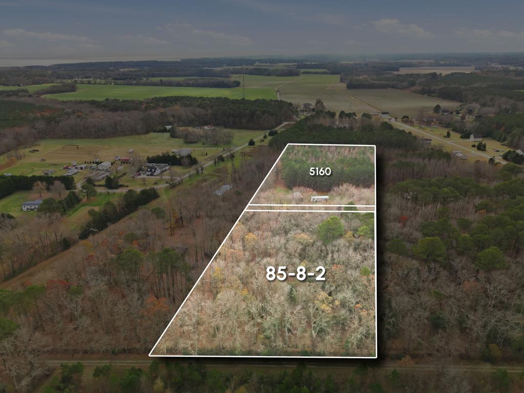 Private seaside cottage sited on 8.62 wooded acres, minutes from the town of Cape Charles. This 616 sq. ft. 2-bedroom, 1-bathroom camp offers peace and quiet, adjacent to nature preserved land for privacy. Set off the beaten path, this property includes a 35' x 25' x 16' high open end Quonset hut for boat storage and a roll up garage door 24' x 12' shed for extra storage/workshop. Trail your boat to Oyster Harbor, the Kiptopeke State Park, or to the Cape Charles boat ramps. Whether for a weekend getaway, vacation rental, or a year-round haven, this move-in-ready property offers the perfect balance of seclusion and convenience. Don't miss this rare find!