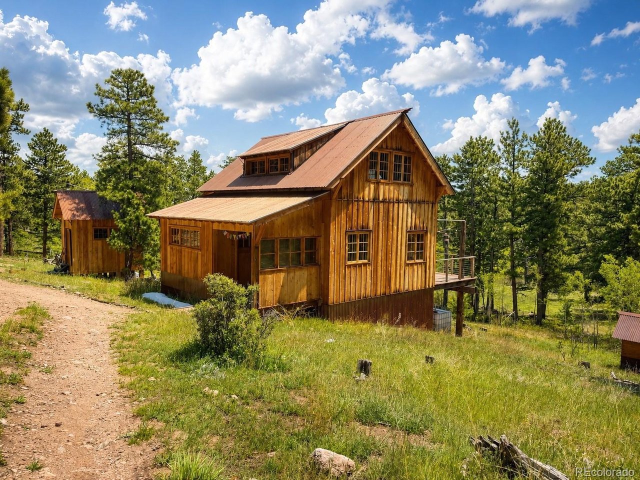 Tucked into a truly one-of-a-kind setting and bordered on three sides by the majestic Roosevelt National Forest,Rarely does an opportunity arise to own 35 breathtaking acres in the heart of Northern Colorado's mountain paradise. Located just outside the charming village of Red Feather Lakes, this extraordinary property offers unmatched privacy, endless recreational opportunities, and a setting that feels worlds away from it all. A year-round mountain creek winds through the land, while the agricultural well adds exceptional value and flexibility for future use. Towering pines, open meadows, abundant wildlife, and direct access to nearby hiking, fishing, boating, and outdoor adventure create the ultimate retreat for nature lovers, sportsmen, and those seeking a legacy mountain property. Complementing the land is a beautifully crafted off-grid cabin along with a separate bathhouse, providing a comfortable basecamp to enjoy this remarkable setting today while leaving endless possibilities for the future. Designed for off-grid living with private well and composting sanitation.