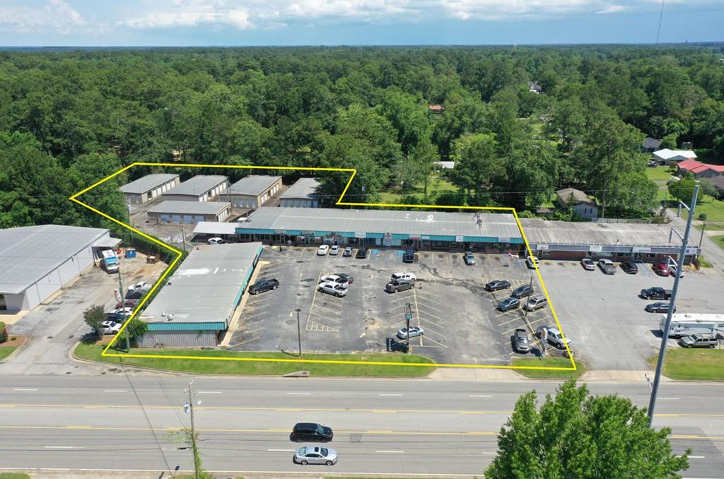 Family Owned and Operated 18,660 SQ FT Strip Center with 11 Tenants(15 Store-Fronts,)  with 110 Mini- Storage Units consisting of 6 Buildings.  Strip Center has 100% occupancy.    Cash Cow with Good Depreciation and multiple income streams.  One of the most convenient locations in town.  This property has provided a good living and income for its current family who had this property built back in the 80s and early 90s.  High Traffic Count and Visibility. Five Lane Jackon Street with Center Turn Lane which makes for easy access, in and out.  GA DOT Annual Average Daily Traffic for 2021 is 15,400.  Some of these businesses have been in this location for years.  Increasing management and upgrades to mini-storage could ramp up existing cash flow to those units.  Compare apples to apples with other strip centers and storage centers and do your math.   Some Income and Expense numbers are available.  Shown by appointment.  Respect the Tenants and make an appointment to view.  Run your own business out of one of these storefronts and manage the rest.  Video Available.