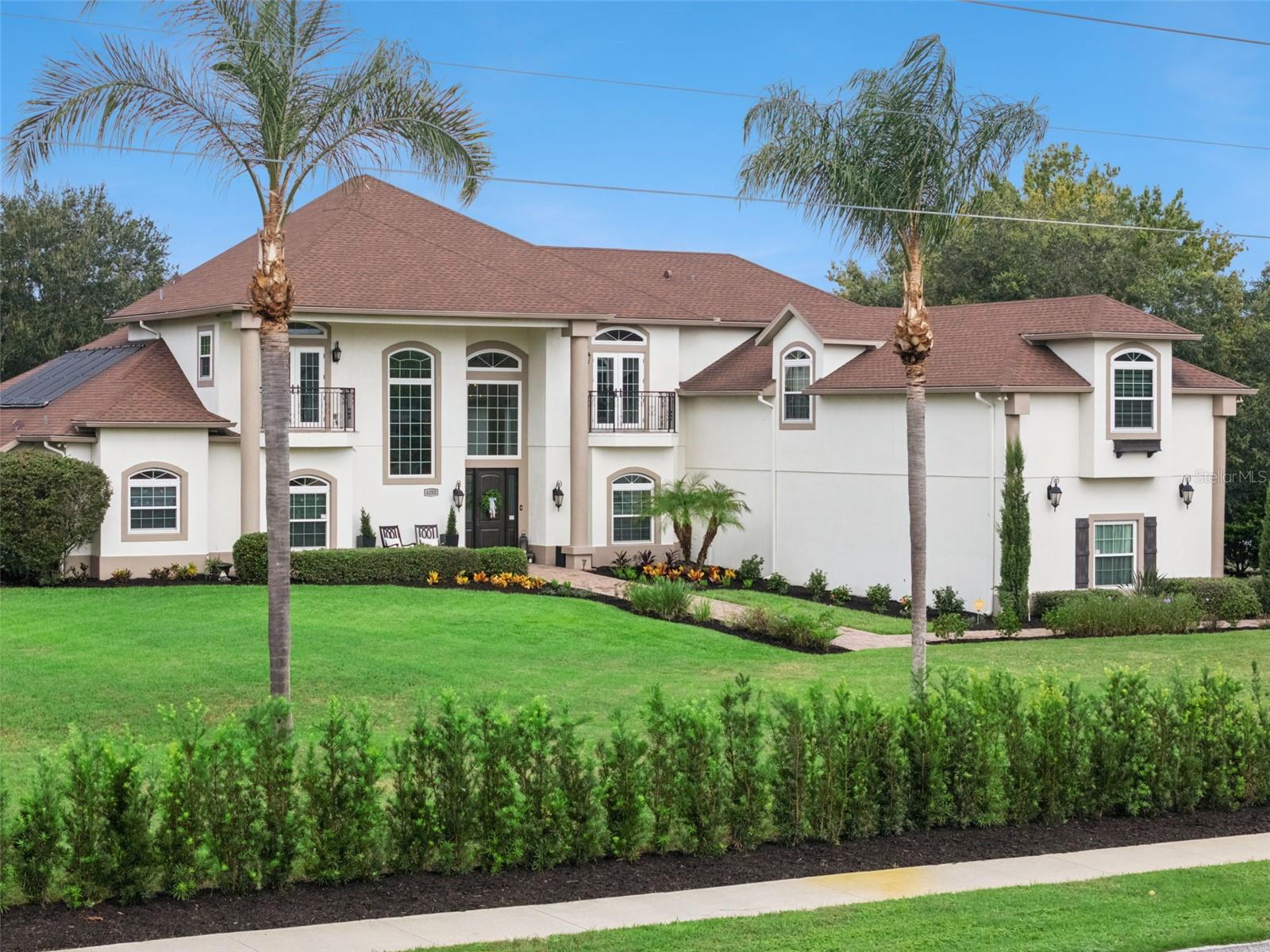 Welcome to 4282 McKinnon Rd, a beautifully updated Windermere estate offering exceptional space, privacy, and flexibility on approximately 1.15 acres—with NO HOA. Featuring 6 bedrooms, 6 baths, nearly 5,900 square feet of living space, a private pool, and 3-car garage, this custom home combines an impressive floor plan with extensive recent improvements.Move-in ready and refreshed inside and out, the home features new windows and doors, new interior and exterior paint, new flooring, new AC systems, a new water heater, and a beautifully renovated pool.The thoughtfully designed floor plan is a standout, beginning with a spacious first-floor primary suite offering privacy and convenience. Also on the main level is a separate guest suite, ideal for visitors or multigenerational living, along with a private dedicated office for working from home.Generous living and entertaining spaces are filled with natural light, while the spacious kitchen offers abundant cabinetry, a center island, walk-in pantry, breakfast bar, and casual dining area.Upstairs, a junior primary suite with a private balcony creates another inviting retreat. Additional bedrooms provide plenty of room for family and guests, while the large bonus room over the garage offers endless possibilities as a home theater, game room, fitness studio, playroom, or additional living space.Step outside to enjoy the Florida lifestyle from the covered lanai and renovated private pool, surrounded by an expansive homesite and mature landscaping. With over an acre to enjoy and NO HOA, there is a rare sense of freedom, privacy, and breathing room.Offering extensive updates, multiple bedroom suites, a private office, oversized bonus room, pool, 3-car garage, over an acre of land, and NO HOA, 4282 McKinnon Rd delivers an exceptional combination of space and versatility in sought-after Windermere.