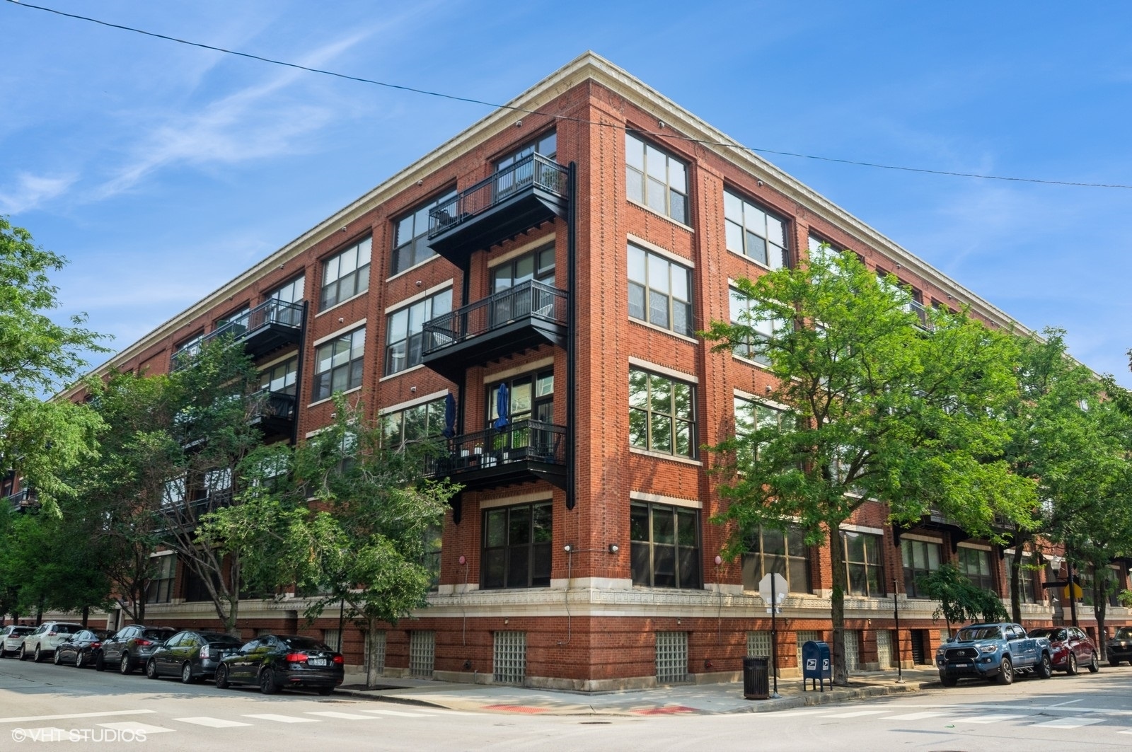 Spacious 2 bed / 2 bath loft in one of the West Loop's most sought-after buildings. Fully enclosed primary suite with walk-in closet and ensuite bath. Soaring 13-foot timber ceilings, exposed brick, hardwood floors, and an open-concept layout create the perfect blend of character and comfort. The kitchen features a large granite island, stainless steel appliances, and ample cabinet space-ideal for entertaining. Living area easily accommodates a full dining table. Enjoy your private east-facing balcony overlooking a beautifully landscaped courtyard. Large in-unit laundry room with stackable washer/dryer. Full-amenity building with 24-hour door staff, fitness center, yoga studio, theater room, business center, conference room, and on-site management. Located in the award-winning Skinner school district and just steps to Randolph Street's restaurant row, Mary Bartelme Park, Mariano's, Target, Whole Foods, and all that West Loop has to offer. Heated garage parking included.