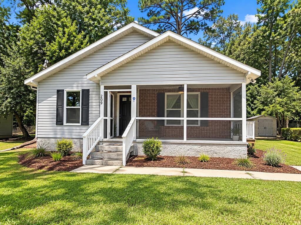 Welcome to 209 Henderson Street! This move-in-ready Thomasville home has been thoughtfully updated with new laminate flooring throughout, upgraded black hardware and fixtures, fresh interior paint, and a brand-new HVAC system with a 10-year transferable warranty. The spacious eat-in kitchen offers plenty of cabinet and counter space, while the newly screened and painted front porch creates an inviting outdoor living area. A newer storage shed adds extra space, and all appliances—including the refrigerator, washer, and dryer—remain. A Eufy security system with three cameras and keyless entry at both exterior doors completes this well-equipped home that's ready for its next owner. Some listing photos have been virtually staged to illustrate potential furniture placement.