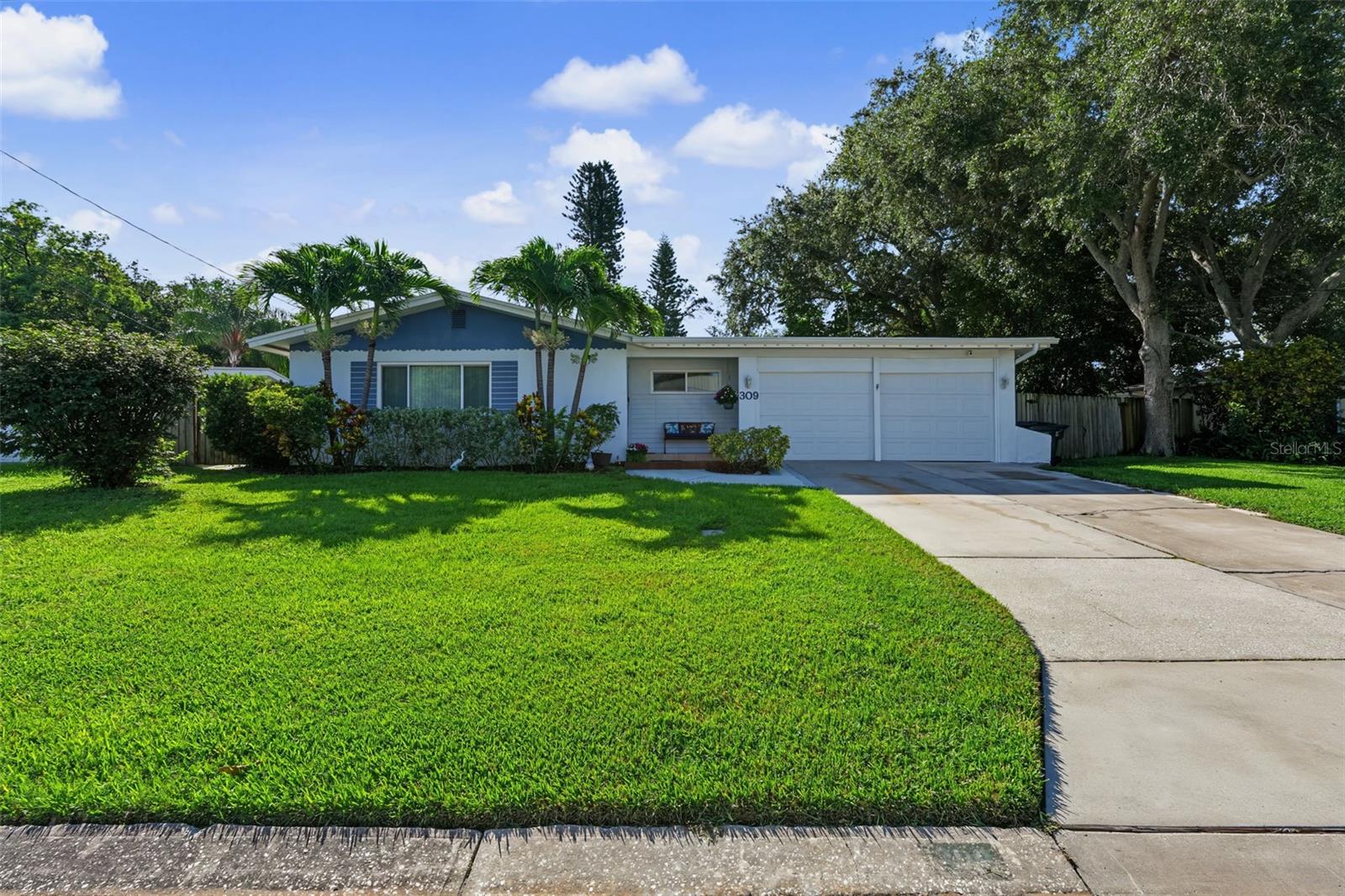 Welcome home to this beautifully maintained TRUE 3-bedroom, 3-bathroom residence, ideally situated in a HIGH AND DRY, NON-FLOOD ZONE offering peace of mind and an exceptional Florida lifestyle. Perfectly located just minutes from the Gulf beaches, the Belleair Boat Ramp, shopping, dining, and major thoroughfares, this home combines comfort, convenience, and functionality. Designed with spacious living in mind, the home features a welcoming living room, a formal dining area, and a separate family room, providing plenty of space for entertaining or everyday living. Each of the three generously sized bedrooms offers the luxury of its own WALK-IN CLOSET, providing exceptional storage throughout the home. The inside utility area is another thoughtful feature, offering additional storage along with the convenience of the opportunity to move the washer and dryer in from the garage. Numerous updates provide added value and efficiency, including a 2020 HIGH EFFICIENCY AIR CONDITIONING UNIT system with a heat pump, with NEW DUCTWORK AND INSULATION (2023) to help reduce cooling and heating costs, a tapered FLAT ROOF (2020) with leaf guard gutters (2024), GARAGE DOOR AND OPENER (2024), NEW FENCE (2024), and WATER HEATER (2026). The home is also equipped with a WATER SOFTENER AND REVERSE OSMOSIS SYSTEM (2024) for enhanced water quality. ENERGY EFFICIENT DOUBLE-PANE WINDOWS FILLED WITH ARGON GAS TO HELP REDUCE UTILITY COSTS WHILE HURRICANE SHUTTERS PROVIDE ADDED STORM PROTECTION. Situated on an oversized lot, the property offers outstanding flexibility with a DOUBLE GATE providing ample space to store your boat, camper, trailer, or other recreational vehicles. AN XL BARN STYLE  STORAGE SHED WITH A LOFT AND ELECTRICITY adds even more functionality for hobbies, projects, or additional storage. Step outside and discover your own private backyard retreat. The screen-enclosed pool creates the perfect setting for year-round enjoyment, while the covered lanai offers an ideal space for outdoor dining, relaxing, and entertaining family and friends. Whether you're hosting weekend gatherings or simply enjoying a quiet evening by the pool, this backyard is designed to be your personal paradise. With its spacious floor plan, extensive updates, oversized lot, incredible outdoor living space, and unbeatable location close to the beaches, the Belleair Boat Ramp, shopping, restaurants, and major commuting routes, this exceptional home truly has it all. Don't miss your opportunity to own this move-in ready Florida gem!