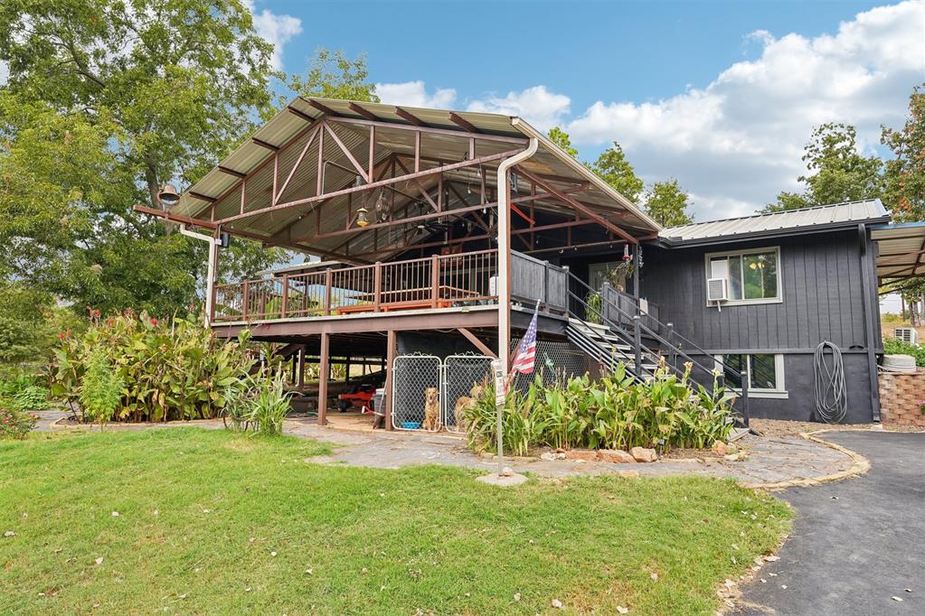 Original build of home was in 1982. However, in 2014 the home was rebuilt internally and externally to the studs. This property comes with: - Beautiful blacktop entry and drive, - Industrial grade 30x40 insulated workshop with electric and an RV hookup.- Generac whole home generator installed in 2023- 2023 Metal roof with proper class , High Impact Resistance Rated, to allow for home insurance discount.- Blueprinted and later received engineering report of a 1500 sq ft metal roof covered Red Iron framed deck with electric and sound system as well as 600 sq ft of uncovered Red Iron Framed deck.- 2023 water well replacement- 2022 septic tank upgrade and lateral line replacement- Full bank solar panels installed in 2025—you can't ignore the immense value of NO OG&E BILL SINCE installation last November. - 80-gallon hot water tank, no running out of hot water during large family or friend gatherings- Discrete Safe/Gun room- The property is surrounded by a custom-built 4"x4" steel post/top rail 6-foot fencing with 11-gauge chain link. Featuring 4 drive thru gates and 2 personnel walk thru gates, - Rain fed creek and pond that attracts wildlife year-round. - The creek has a 4' tinhorn driveway to allow for mobile access to the other section of property. - Washer and dryer hooks up both upstairs and downstairs. The stackable unit upstairs is staying with the house. - Quartz counter tops- Pantry with pull out drawers- Soft close deep drawers- Gas cooktop and electric oven- 4" gutters with leaf guard and 4" and 8" down spouts- Landscaped rock pathways surrounding deck.The deck features: • concrete floored under storage and dog kennel• Upper and lower cabinets with stainless steel countertops.• A 2020 Propane Napolean grill• Refrigerator and full-size freezer, hidden behind barn doors, • the 12-foot ash wood top table with plasma cut steel adjustable base, will stay after sale. Making these areas a fully functioning outdoor kitchen and entertainment hub.