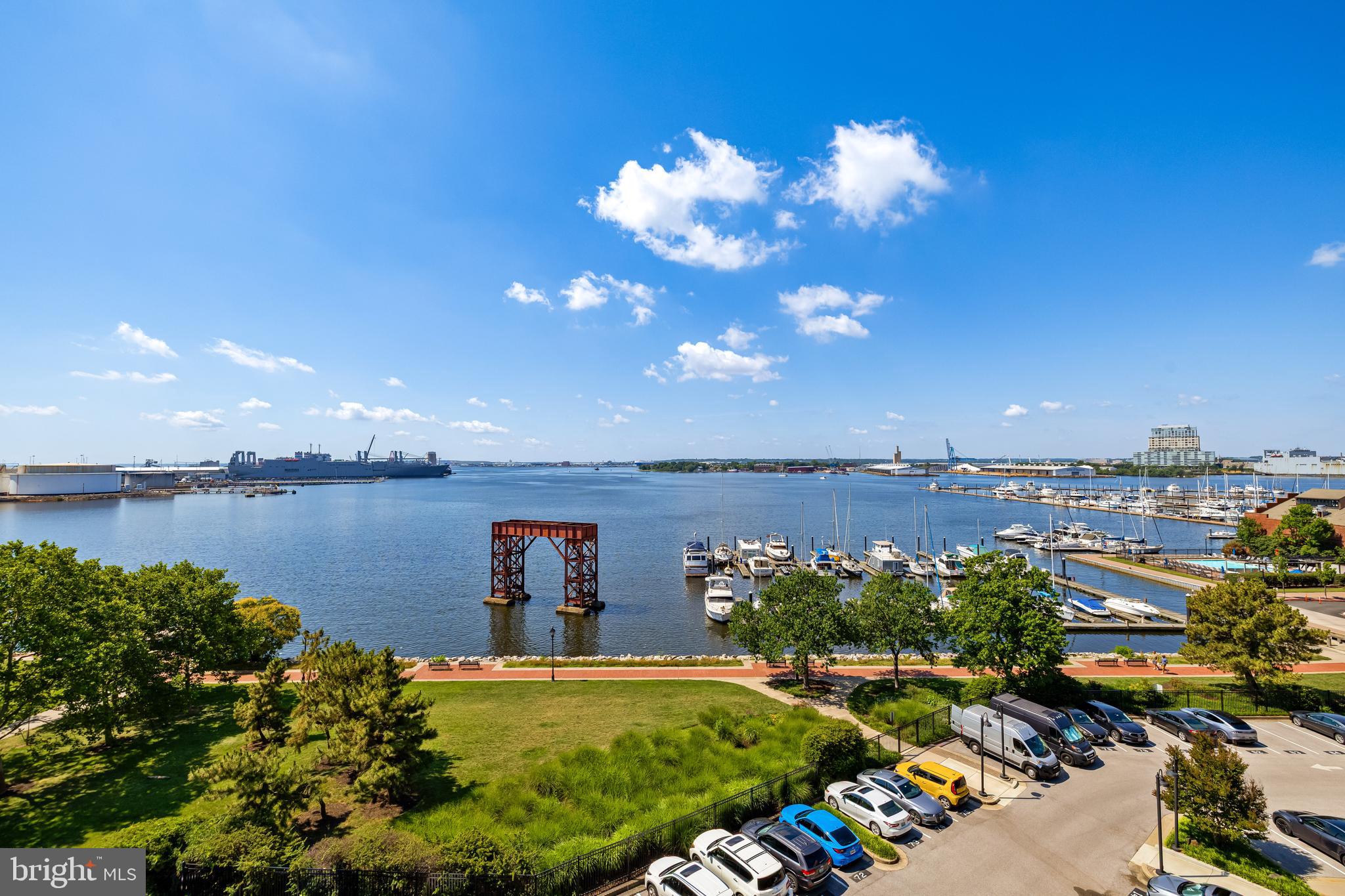 Welcome to #406 at Canton Cove, 64 ft of Waterfront Decking. Perfect for Entertaining, Family gatherings or Everyday relaxation. Open the front door to 9 ft Ceilings, Floor to Ceiling windows with Spectacular views from nearly every room. The unit was refurbished in 2019. Kitchen includes an eating area, KitchenAid appliances, Granite Countertops and in close proximity to the Laundry Room. You really must see to appreciate this rare opportunity.  In addition to the View, there are 2 assigned parking spaces and 2 Storage units that convey with the property.The Seller of this unit is a member of the Canton Cove Marina. The Marina is private and separate from Canton Cove Condominium. The membership does not convey with the property. The Seller may consider a separate agreement to transfer Marina membership to Buyer if interested