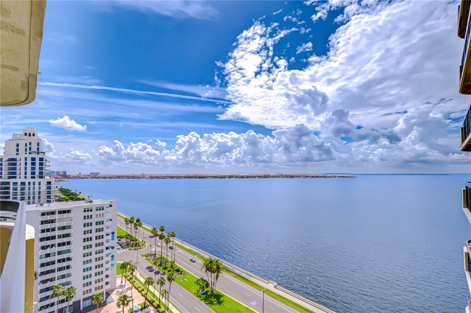 Welcome to life along Tampa’s most celebrated address — Bayshore Boulevard, where endless water views and vibrant city living come together. Perched on the 19th floor of The Atrium, this stunning two-bedroom, two-bath residence offers front-row seats to breathtaking sunrises, sparkling bay waters, and some of Tampa’s most iconic events — including the world-famous Gasparilla Parade, all from the comfort of your private, wrap-around balcony. This light-filled home blends classic character with modern touches, featuring fresh interior paint (2025) and plush new carpeting. Plantation shutters throughout add timeless charm, while the spacious dining area welcomes you with natural stone tile flooring that flows seamlessly into the well-appointed kitchen. Here, sleek black granite countertops, stainless steel built-in appliances, a tile backsplash, pull-out drawers, and a cabinet pantry offer both style and functionality — all with bay views to inspire your inner chef. The expansive great room features custom built-ins and panoramic water views across two walls, thanks to dual sliding glass doors — including a dramatic wall of sliders that opens from the center, blending the indoors with Tampa’s breathtaking outdoors. The generous primary suite is privately positioned at the back of the home, with balcony access, plantation shutter sliders, a large walk-in closet with built-ins, and a spacious en-suite bath with a walk-in shower. The well-sized second bedroom and additional full bath provide comfort for guests or flexible living space, while the dedicated laundry room adds everyday convenience. Life at The Atrium means more than just a beautiful home — it’s an exclusive waterfront lifestyle. Enjoy 24/7 secured building access, two assigned parking spaces, and resort-style amenities including a bayside pool and spa with endless views, a fully equipped fitness center, tennis courts, and a resident lounge with a catering kitchen — perfect for entertaining. The soaring, tropical lobby with a cascading fountain sets the tone for the upscale experience The Atrium is known for. This prime location offers unbeatable walkability and easy access to everything South Tampa has to offer — minutes from vibrant Hyde Park Village, Downtown Tampa, the Riverwalk, Amalie Arena, and top-rated dining and shopping. Whether you’re watching Gasparilla from your balcony, enjoying scenic walks along the boulevard, or joining the energy of Tampa’s thriving entertainment and waterfront districts, this is truly Bayshore living at its finest. Copy and paste the link here to tour the home virtually: my.matterport.com/show/?m=uDG1Q99Pbux&mls=1