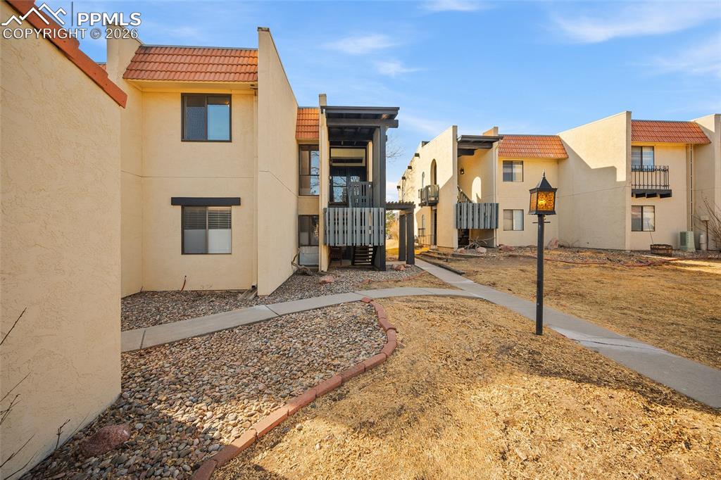 Welcome to Villa Sierra Condominiums on Colorado Springs’ highly desirable west side. This beautifully updated 3-bedroom, 2-bath second-floor condo offers breathtaking views of Pikes Peak and Garden of the Gods the moment you walk through the door. Natural light fills the open living and kitchen space, perfectly framing the mountain backdrop from both the windows and private balcony. Inside, you’ll find stunning wood beams, commercial-grade LVP flooring, fresh paint, and a cozy fireplace featuring a striking herringbone tile detail. Both bathrooms have been completely remodeled with timeless subway tile finishes. Modern conveniences include a smart thermostat and keyless entry. Enjoy community amenities including security, a heated pool, and pickleball/tennis courts. With trails nearby, minutes to Garden of the Gods, and easy access to the mountains, this home offers the Colorado lifestyle so many dream about. Includes covered carport parking and a 10x10 attached storage unit.