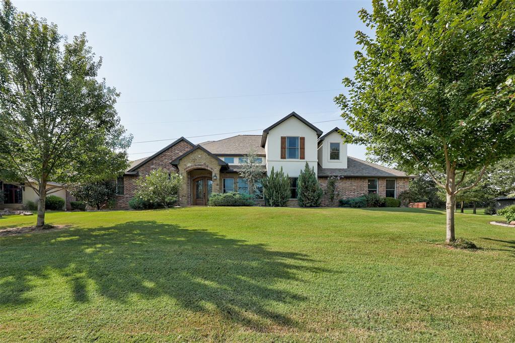Stunning custom-built home in beautiful, gated Redmont Trace. Sitting on a .88 acre MOL lot, this property has tons of room to run and play. The side entry garage, mature landscaping and gorgeous exterior create amazing curb appeal. As you step inside, you will be greeted by soaring ceilings and great natural light ushered in by all the massive picture windows. The great room offers a spacious living area, dining space and kitchen for the perfect place to gather with friends and family. The kitchen would make a pro-chef swoon with 5 burner gas cooktop, double ovens, pot filler, island for prep space, wine/coffee bar, pantry and an additional island with bar seating. The Primary suite is a true retreat with spacious bedroom, a coffee bar and spa-like bathroom with soaking tub, shower with two-sided entry, two vanities and a walk-in closet. There are two secondary bedrooms downstairs with a Jack & Jill bathroom. Upstairs offers two more bedrooms and a full bathroom. A fabulous media room with 168" movie screen, bar seating and room for comfy theater chairs or a nice big sofa completes this gem of a home. Step out back to enjoy the massive yard and outdoor living area with spacious covered patio, fireplace, ceiling fans and tv hookup. Roof replaced in 2024.