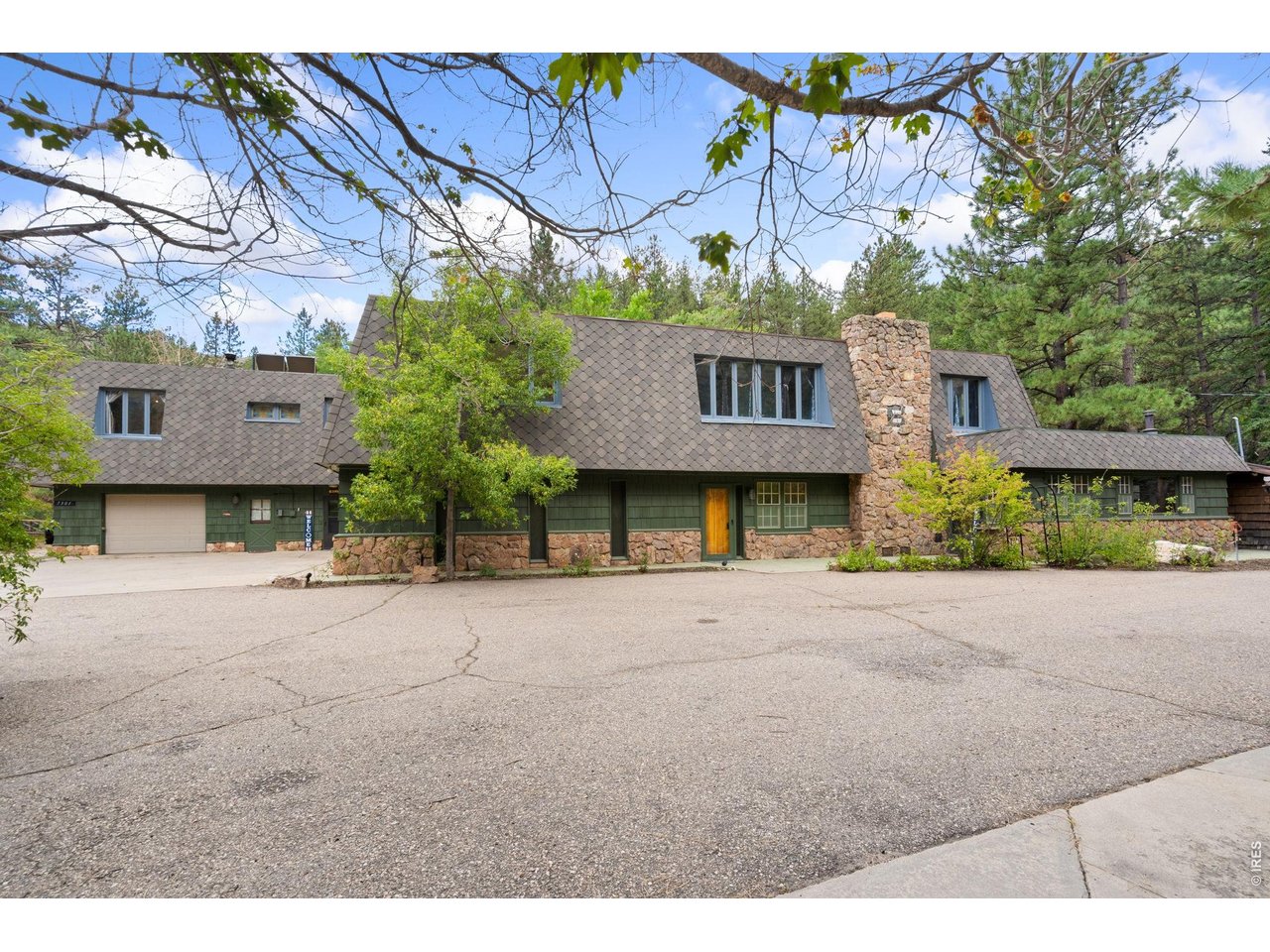 Your ultimate mountain retreat awaits! Set on 3.75 acres in stunning Poudre Canyon, this one-of-a-kind property offers the soothing sounds of the Cache La Poudre River right across the way, paired with abundant wildlife and mountain scenery. Offering over 6,000 sq ft of possibilities, this remodeled multi-generational residence is designed for maximum versatility, featuring thoughtfully separated living quarters, three kitchens, five bedrooms, and four bathrooms. There is endless room to spread out, create private spaces, or customize the layout to fit your lifestyle. Warm wood floors bring natural character throughout, while three fireplaces and a classic wood stove create cozy gathering spots. One of the kitchens has been beautifully updated with new cabinetry and a massive center island. The massive primary suite features new carpet, direct access to a private deck, and a luxurious remodeled bath with an oversized walk-in shower. Outside, immerse yourself in canyon living with an oversized patio with an outdoor fountain, stepped gardens, and a riverside fire pit for starry Colorado evenings. A separate studio apartment adds even more flexibility, perfect for long-term guests, multi-family living, an opportunity for rental income. Situated just 6 miles from the famous Mishawaka Amphitheatre and 20 minutes from Old Town Fort Collins, this canyon sanctuary puts outdoor adventure, hiking, and live music right at your doorstep while keeping town amenities within easy reach!