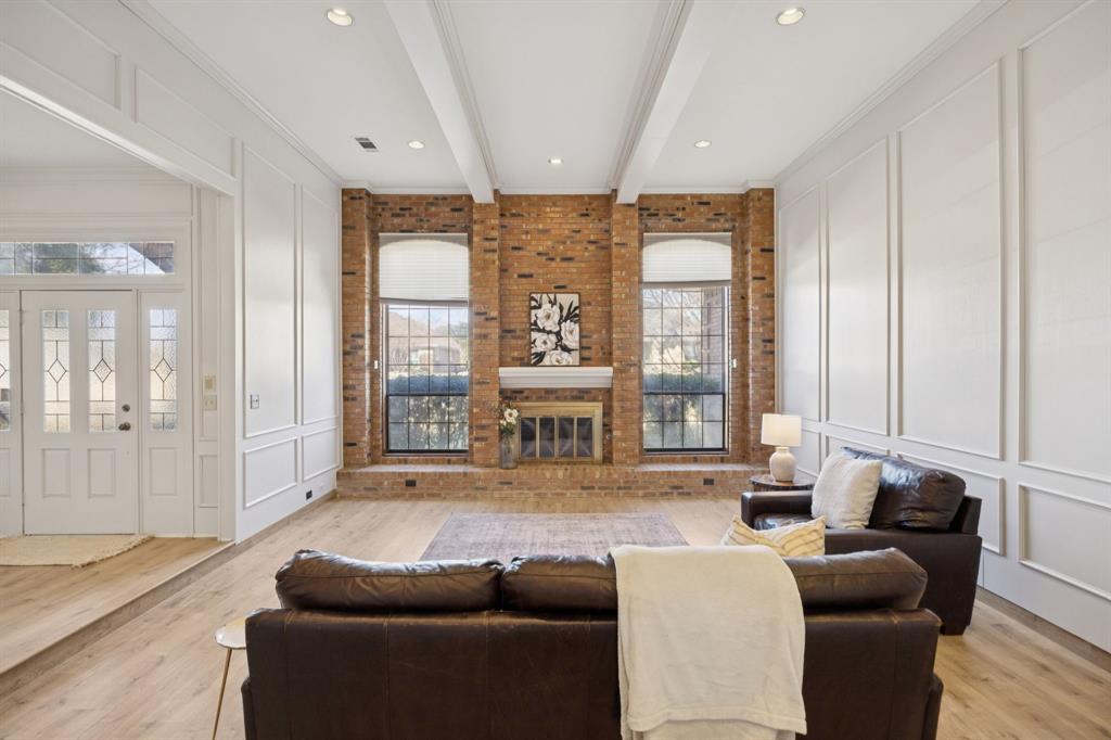 Welcome to this beautifully updated 4-bedroom, 3-bath home in the heart of Plano, offering an exceptional blend of space, character, and comfort. Thoughtfully designed with two expansive living areas, this home provides flexible spaces ideal for both everyday living and entertaining.At the center of the home, the kitchen is complemented by a unique built-in bar area, creating a natural gathering spot for hosting or casual evenings at home. Light-filled interiors showcase timeless finishes, modern wood flooring, and architectural details that add charm and distinction throughout. The spacious primary suite serves as a private retreat, featuring a generously sized bathroom with ample storage and walk in closets. Secondary bedrooms are well-proportioned, offering versatility for guests, home offices, or growing households. Step outside to your own backyard oasis, complete with a sparkling pool, perfect for Texas summers, outdoor entertaining, or quiet relaxation. Conveniently located near shopping, dining, and top-rated Plano amenities, this home delivers both lifestyle and location. A rare opportunity to own a home that balances functionality, style, and inviting living.