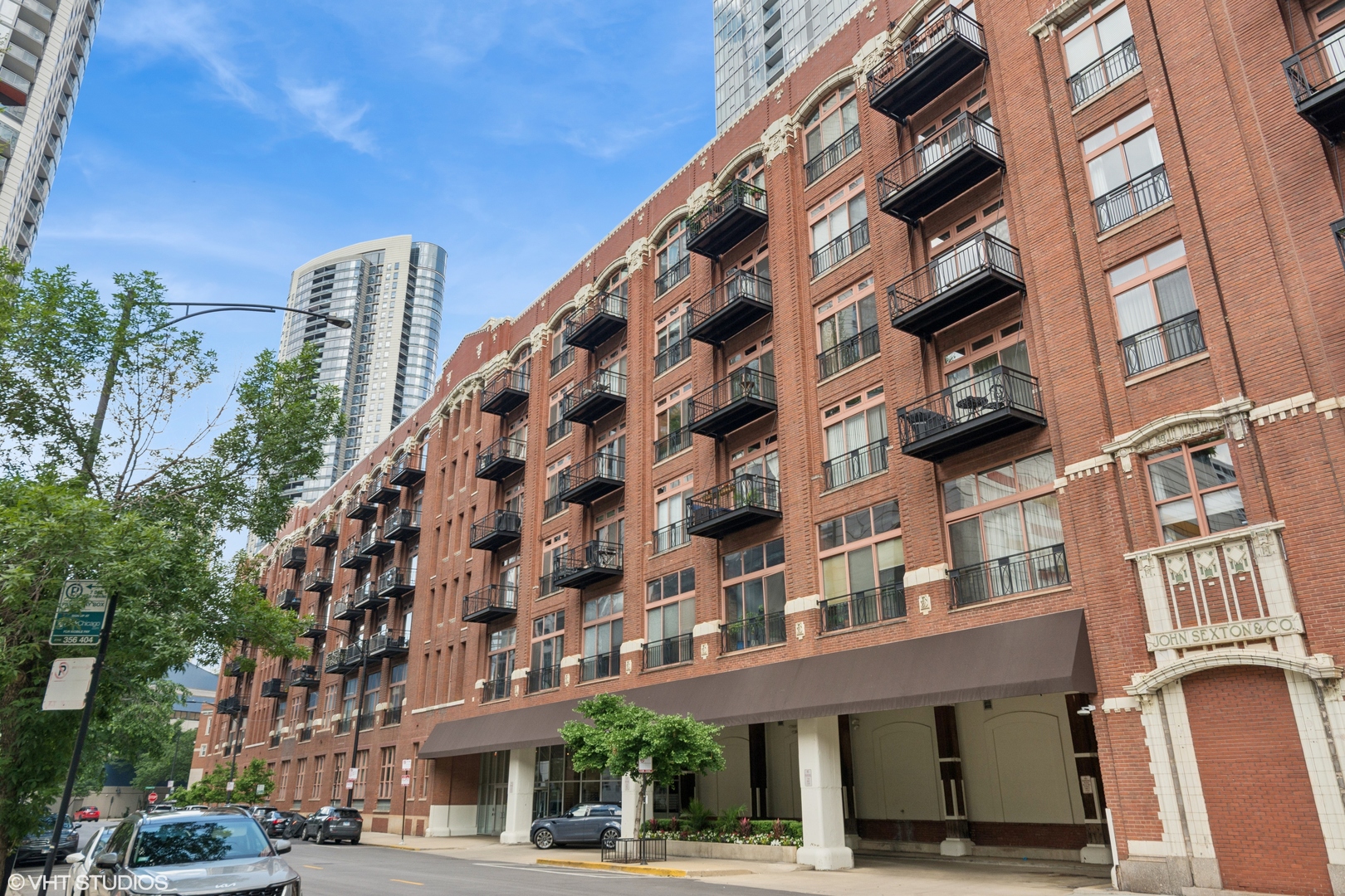 Welcome to charm and serenity in this stunning brick and timber residence at the coveted Sexton Lofts in vibrant River North. This light-filled two-bedroom, one-bath corner home is uniquely positioned above the building's expansive courtyard, offering unobstructed views of both the courtyard and the city-the only 2-bed/1-bath layout on the timber side of the building with this rare vantage point. The wide, open floor plan features a spacious living and dining area with plenty of room to entertain. The modern kitchen includes a large island, perfect for gatherings, and flows seamlessly into the main living space. Original brickwork and oversized arched windows fill the home with natural light and character. The primary bedroom serves as a cozy retreat with a walk-in closet and private access to a generously sized bathroom with a whirlpool tub. The second bedroom, which maintains an open layout, works beautifully as a guest space or home office, complete with large closets and convenient bathroom access. A pantry/laundry room off the kitchen adds everyday convenience and extra storage. An extra-large heated garage parking space and an extra-large storage unit are included in the price. Residents enjoy a full suite of amenities, including 24/7 door staff, on-site engineer and management, dry cleaners, package receiving room, and a phenomenal fitness center. Located in the heart of River North, you're just steps from the East Bank Club, the Chicago Riverwalk, and an abundance of 4- and 5-star restaurants, cafes, galleries, and nightlife. This is city living at its finest-blending timeless character, modern convenience, and unbeatable access to everything Chicago has to offer.