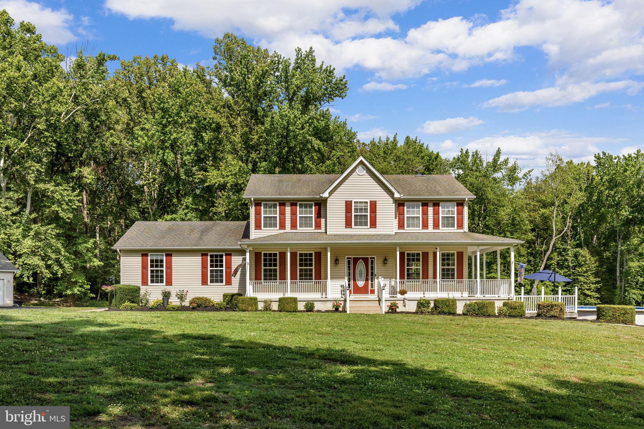 A Rare 6.89-Acre Equestrian Farmette! Set on nearly seven private acres zoned Agricultural A-2, this three-story Colonial pairs comfortable country living with a setup built for horse owners, livestock keepers, and hobbyists alike. A six-stall stable, hay barn, riding arena, and four pastures anchor the equestrian side, while an equipment building, multiple garages, and a spacious hay barn offer the kind of flexible space that suits campers, boats, trailers, a workshop, or a home-based business.Inside, the upper level holds four bedrooms and a primary suite with dual closets, a jetted soaking tub, separate shower, and double-sink vanity, all finished in luxury vinyl plank flooring. A hall bathroom with double sinks and an upstairs laundry round out the level.Downstairs, 9-foot ceilings frame a kitchen with tall oak cabinetry, stainless appliances, and a pantry, opening onto dining, living, and family rooms warmed by ceiling fans and connected flooring throughout. A screened porch with fresh 2024 screens leads to a deck overlooking the riding arena, an easy spot to watch the horses graze. The finished lower level adds a rec room, full bath, and a flexible den and study that could serve as two more bedrooms.The home has been steadily updated: a 2024 heat pump on the upper level, two-zone heating and cooling throughout, a new water heater, recent septic pump, and freshly power-washed siding under warranty. Outside, an above-ground pool with a newer liner, pump, filter, and deck boards makes for easy summer living and long days relaxing in the sun.The stable (2023) offers six 12'x12' stalls, a wash rack, and a 12'x24' tack room with saddle racks for a dozen, equally suited to horses or other livestock. The adjacent 56'x48' hay barn adds generous storage for feed and equipment, and its scale makes it just as practical for a workshop, hobby space, or small business. Stables like this are rare at this price point and are truly a luxury that is worth the investment. Round out the package with an attached two-car garage and a detached two-car garage, and this farmette is ready for its next chapter.Note: property recently surveyed to 6.89 acres; county tax records pending update. Shared driveway. This property is listed under Farm MLS# VAKG2008230