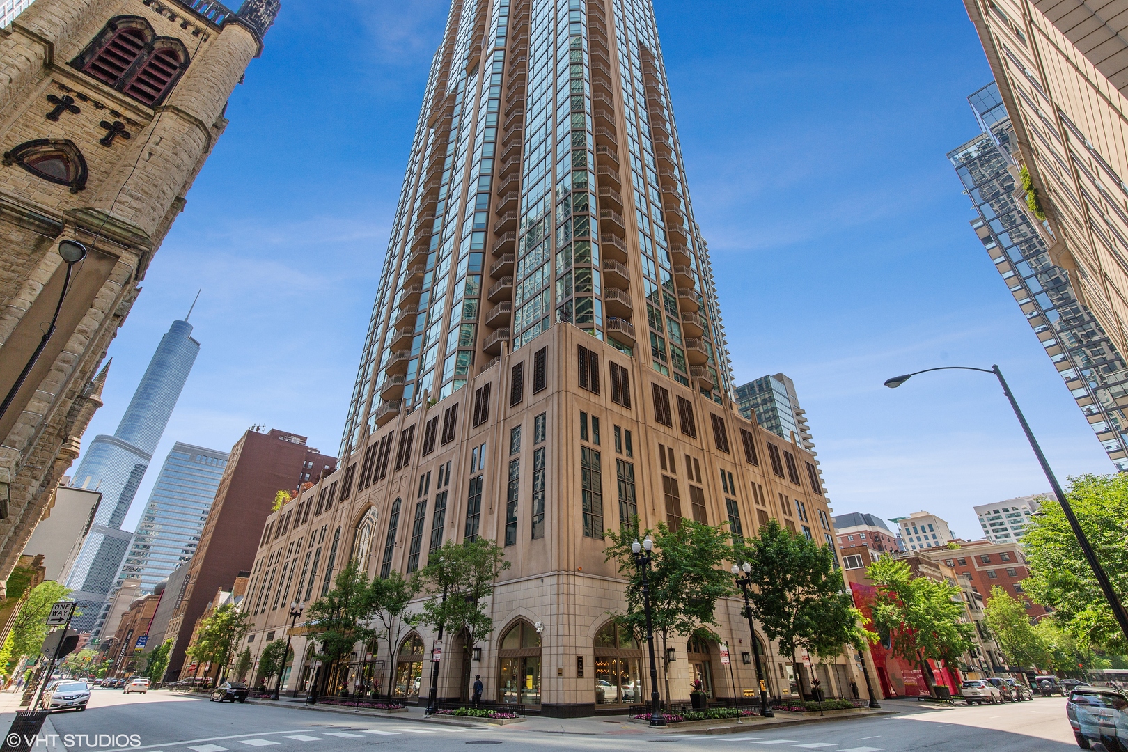 Live in luxury at the prestigious Pinnacle, designed by architect Lucien Lagrange. This large 1BR/1.5BA condo has floor-to-ceiling windows with beautiful west views for the perfect sunset - sit on the private balcony and enjoy. Open kitchen with granite counters and SubZero refridgerator. Separate dining area and living room with fireplace. Powder room off the foyer. Spacious master bath with black out shades, large walk-in closet and large master bath suite with double sinks, soaking tub and separate shower. Washer and dryer in unit. Garage parking INCLUDED. Pet friendly - dog run in building. Full amenity building with concierge services, 24hr door staff, new fitness center, indoor pool/spa, relaxing outdoor garden terrace, wine cellar, private movie theater, staffed receiving room and onsite dry cleaning. Steps to Michigan Avenue shopping, tons of fabulous restaurants, Whole Foods and Jewel! Perfect building in the perfect location.