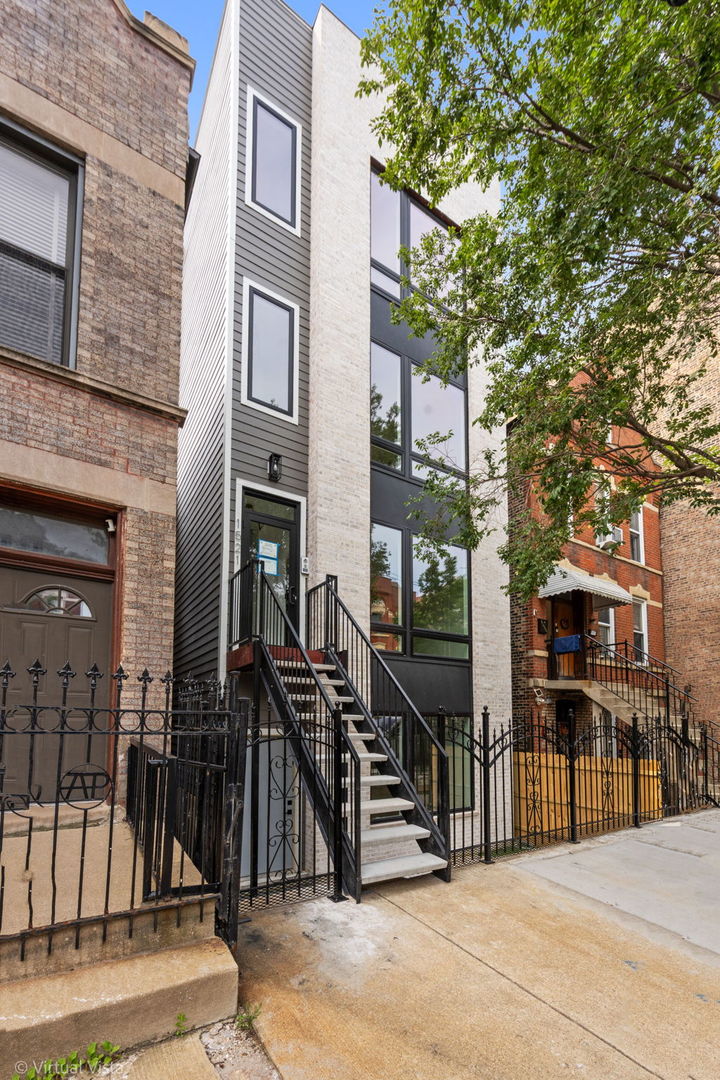 Stunning and luxurious NEW CONSTRUCTION DUPLEX DOWN by a well-known luxury builder, located in a boutique three-unit condo building nestled within a quiet coveted enclave of Pilsen that seamlessly blends urban convenience with tranquil residential living. Spanning approximately 2,200 square feet, this enormous residence is set in one of the neighborhood's most desirable locations-just steps from the vibrant 18th Street corridor and offering exceptional access to the Pink Line (0.3 miles), Halsted Metra (1 mile), Expressways (1 mile), UIC (1 mile), and Harrison Park (0.4 miles), while being surrounded by award-winning restaurants, cultural landmarks, art galleries, and dynamic nightlife. Set within a striking masonry and Hardie exterior, this home lives like a single-family residence and features a generous open-concept living space with soaring 9-foot ceilings and oversized windows that bathe the interior in natural light. The main level showcases a chef's kitchen equipped with custom cabinetry, high-end quartz countertops, a 10-foot waterfall island, premium KitchenAid stainless steel appliances, a full-size pantry, and a breakfast nook-all anchored by custom millwork that flows into the spacious living and dining areas, making it perfect for entertaining. Solid white oak flooring runs throughout, enhancing the clean, modern aesthetic. The serene primary suite features a spa-quality bath with an oversized walk-in shower, a 9-foot double vanity with white oak cabinetry, a walk-in closet, and access to a private front terrace. Three additional bedrooms provide versatile options for family, guests, or a home office, while a tiled mudroom, in-unit laundry, and private rear trex deck add convenience to everyday living. Tons of storage, smart thermostat, keyless entry, and one dedicated parking space included. With exceptional scale, refined finishes, and a prime location near transit and culture, this one-of-a-kind home presents a rare opportunity in one of Chicago's most vibrant neighborhoods.