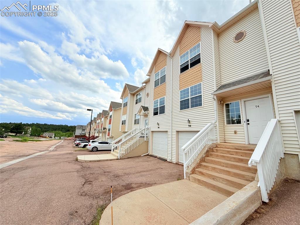 Welcome home to this beautifully remodeled three-story townhome in Palmer Lake.  This home offers 3 beds, 3 baths, and 1 attached car in historic downtown Palmer Lake.  Brand new Mohawk wood laminate throughout the main level, new stainless-steel appliances, new quartz countertop, new paint, new flooring throughout the house, and new light fixtures. Main level features a roomy bright kitchen with updated cabinets, nice size living room with fire place and a walk out to the back yard with gorgeous mountain view. Upstairs offers a large primary bedroom with vaulted ceilings and a large closet and updated full bathroom, stackable washer and dryer, large secondary bedroom and hall bath. On the lower level of the home, you will find a 3rd bedroom, large bathroom, and storage closet as well as access to your private garage. This beautiful home is show ready!