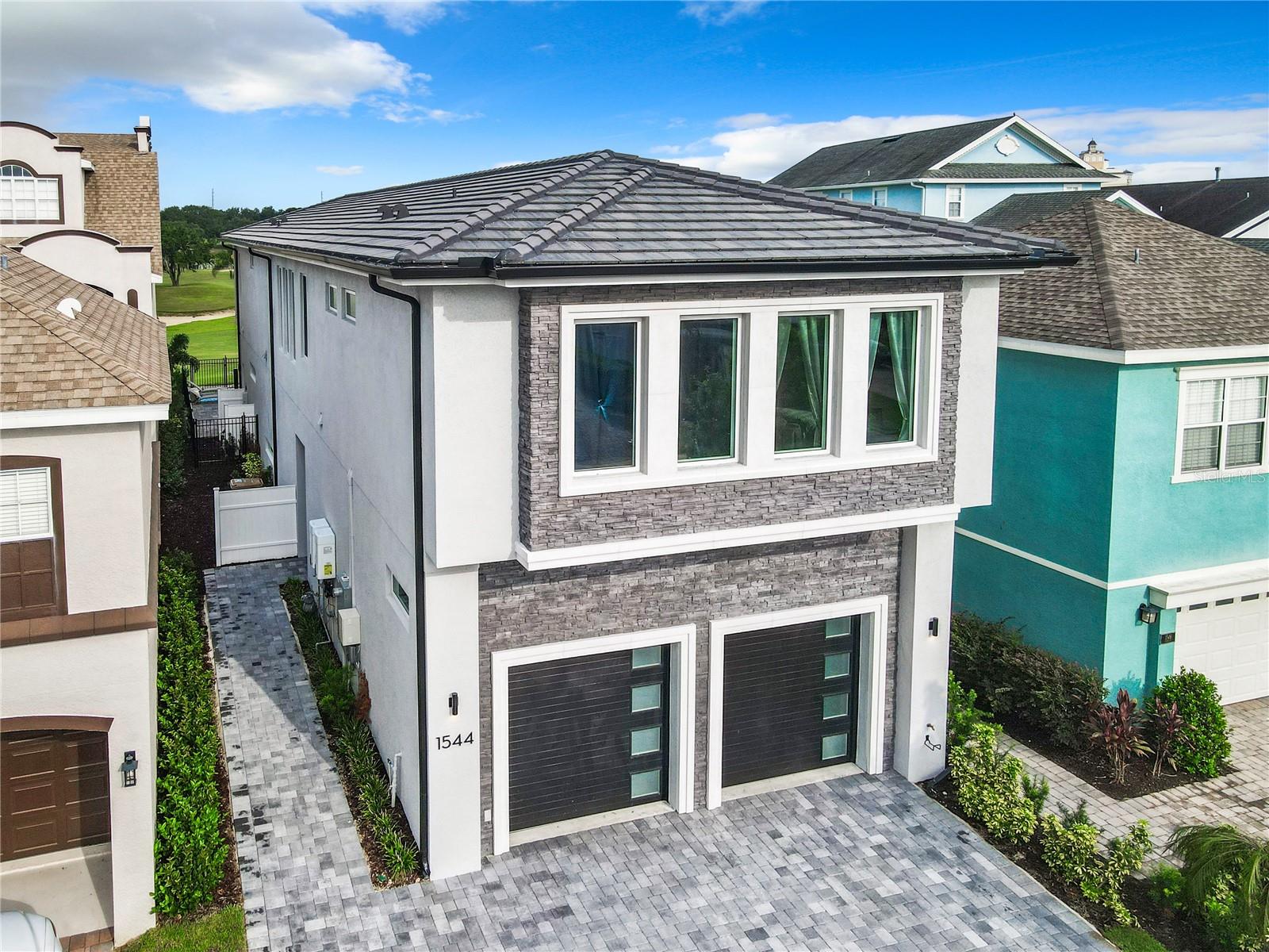 Escape to a world of indulgence and relaxation. Introducing the Ultimate, Brand New, Luxury Reunion Resort home with a great golf course View. Prepare to be captivated by the stunning signature view from the rear of this magnificent property. This modern masterpiece, overlooks the lush Arnold Palmer golf course. Immerse yourself in luxury as you step into this exquisite home, prepare to be impressed with its impeccable highend finishes and design, that set the stage for what awaits inside. The elegant foyer welcomes you with beautiful white high gloss 24 by 48 tile flooring, setting the tone for the rest of this exquisite residence. The sleek and ultra-modern kitchen features stainless steel appliances, 5-burner gas stove and a spacious quartz island. Unique light fixtures, two stainless steel refrigerators, two dishwashers, range hood, and built-in double oven under cabinet built in microwave, complete the overall picture of elegance. The bright, open plan living and dining areas are perfect for hosting guests, featuring attractive, contemporary furnishings; expansive, sliding glass doors, a large HD-TV, and a custom-built bar. The dining room offers a functional dining table with ample seating for you and your guests. The home includes 7 suites all with there own bath. Combine two rear suites over looking course and pool for one large master with two bathrooms. Upstairs, you can indulge in loft for TV, and a pool table. Step outside to your custom swimming pool, complete with a spillover spa, sun shelfs and ledge loungers, soak up the sun, and savor delicious barbecues in your outdoor summer kitchen with drop drop down screens to be bug free. This home comes fully furnished and turnkey ready, ensuring a seamless transition for your 6 luxury getaway. This is luxury living at its finest. The guard gated, Reunion Resort provides a luxurious experience with 12 community pools, 3 signature golf courses by Watson, Palmer and Nicklaus, a multi-million dollar water park, several onsite restaurants, golf pro shops, hydro-grid clay tennis courts, a full-service spa, and even a brand new miniature golf course. Escape to a world of indulgence and relaxation. With a Reunion membership, you can experience the ultimate 6 resort lifestyle that this community offers, all just minutes from the Walt Disney World theme parks and local Orlando area attractions. Your expectations will be exceeded. Call for your private viewing. All information provided and contained herein this listing, is deemed reliable but is not guaranteed and should be independently verified by buyer or buyer's agent.