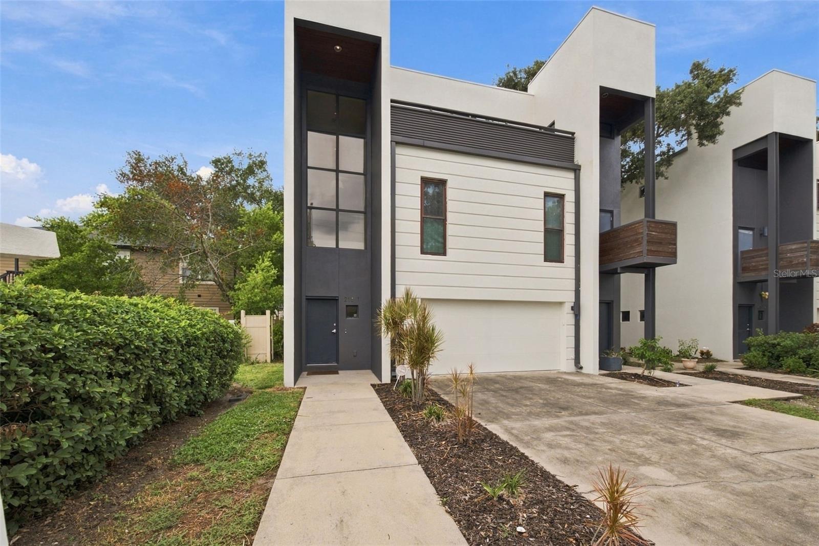 Virtually Staged. LOCATION, LIFESTYLE, INVESTMENT POTENTIAL! This SoHo stunner puts you right in the heart of it all, just minutes from Downtown Tampa, Howard Avenue, the University of Tampa, Armature Works, and more.  And the location is only the beginning. At 2,541 square feet, this townhome is a RARE find and one of the largest available at this price point. Its desirable position provides additional windows, abundant natural light, and something especially hard to find in townhome living—a private, fenced and turfed side yard.  Looking for even more outdoor living space? Head up to the ROOFTOP LOUNGE, where you’ll find a BUILT-IN OUTDOOR KITCHEN complete with a grill, sink, and refrigerator. This expansive rooftop retreat is perfect for dining alfresco, relaxing with friends, or watching the game on the outdoor TV, or enjoying the sunset views.  Designed with entertaining in mind, this home offers inviting gathering spaces on EVERY level. Step through the front door into a dramatic three-story foyer highlighted by a striking wall of stacked windows. Down the hall, you’ll find a half bath, the first of two family rooms, and a sleek, European-inspired kitchen featuring abundant cabinetry and a generous island—the perfect spot for guests to gather while the chef is at work.  The second floor offers an impressive 20' x 20' BONUS room for movie nights, a game room, or additional entertaining. Down the hall are two secondary bedrooms, each with custom closet shelving, along with a shared bathroom. Need another bedroom? The loft includes a closet and offers the flexibility to become a fourth bedroom, home office, or gym.  The third floor is home to the expansive primary suite, privately situated opposite the rooftop lounge. There’s plenty of room for a king-sized bed and additional furnishings, along with two large custom closets. The spa-like primary bath offers a relaxing escape with a soaking tub, walk-in shower, and dual-sink vanity. A conveniently located laundry room completes this level.  Additional highlights include an oversized two-car garage, NEW exterior paint, multiple storage closets, wood flooring throughout, and ALL-BLOCK construction.  Located in an X flood zone, the home does not currently require flood insurance.  Combine that with LOW HOA fees, highly sought-after schools—Mitchell, Wilson, and Plant—and a flexible short-term rental policy.  This property has something for everyone.   SPACIOUS. PRIVATE. WALKABLE. Entertainer-friendly. And right in the heart of SoHo. The only thing missing is you!  Schedule your showing today!