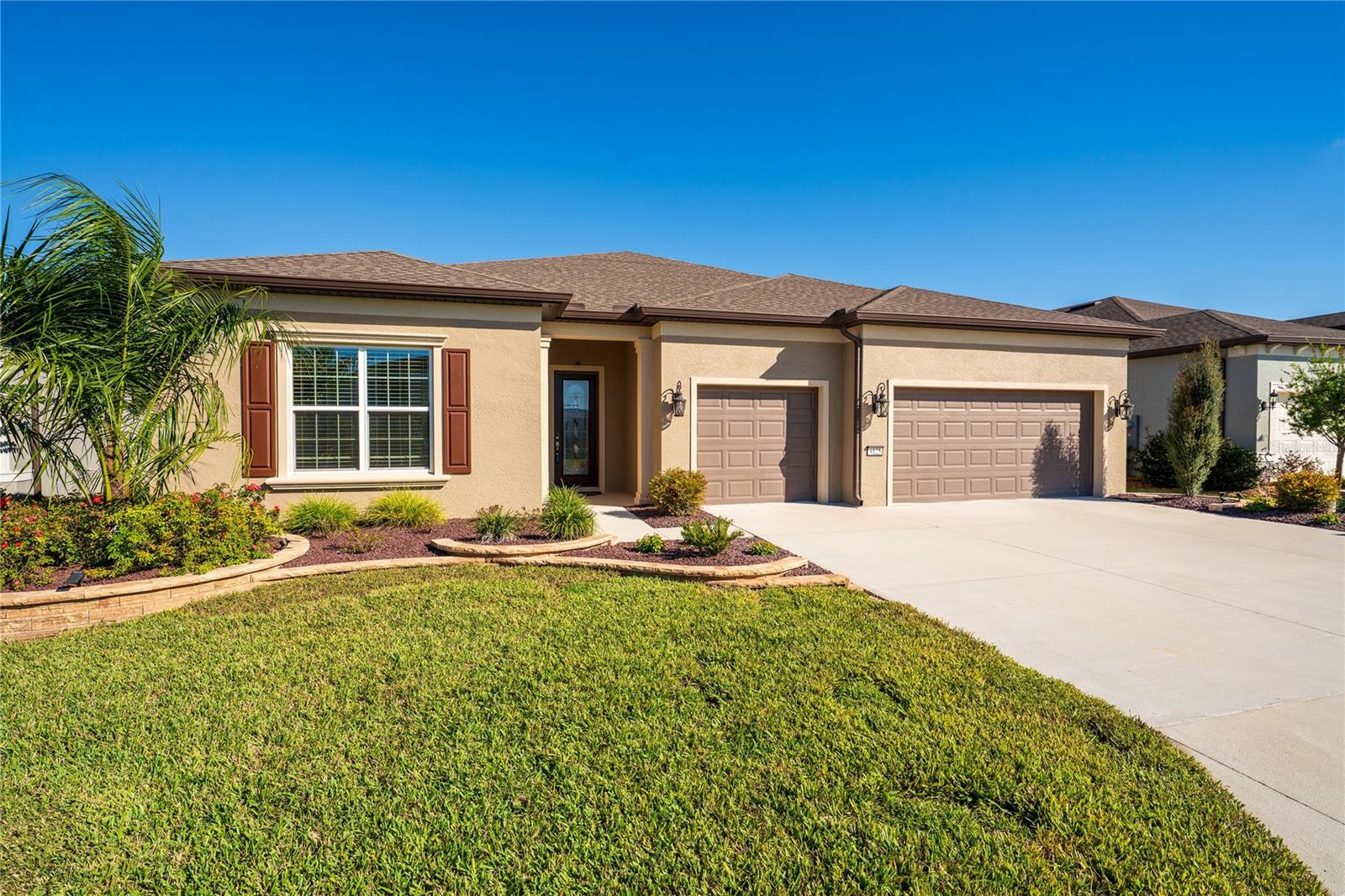 LOWER PRICE! ESCAPE TO YOUR OWN PRIVATE HOME PARADISE! Located in beautiful Del Webb Stone Creek! This Renown 2022 model has everything a luxury home gives. PRIVATE SWIMMING POOL WITH A SPECTACULAR GOLF COURSE VIEW, not to mention the rocky dry retention area beyond the golf course WOW! This spacious home checks all the boxes. Exterior has upgraded coach light on timers, glass insert on the front door with Wi-Fi keypad lock and professionally landscaped. The exterior front home window has custom crowning and shutters, giving it that special touch. The home opens up into a nice foyer entry, the dining, living room and open floor plan kitchen makes you feel right at home. Wood style ceramic tile with luxury vinyl planking in the bedrooms, NO CARPET.  A quiet newer dishwasher, composite sink with touchless faucet, soft close doors and alluring quartz countertops and auto sensor lighting for the big pantry. Fans in every bedroom and family room,  Immediately feel the luxury vinyl plank flooring throughout, split floor plan with 2 bedroom guest suites for a total of 3.5 baths. Master bedroom provides two large walk in closets and doorway right into the laundry room, which can also be accessed from the garage open entry. Motion lights have been added in the laundry room, and master bedroom, never be in the dark. You will love the auto powered window blinds in the master bedroom, flex room, dining, cafe and family rooms. Windows facing east and west have been improved Lexan panels on East and West windows only. This home has rounded walls with a warm all home color. Enjoy the cleanest water with a whole home Eco-water filter and softener in addition to the reverse osmosis kitchen water filter. Walking through the sliding doors into your private pool area, giant birdcage and outdoor kitchen with grill. The pool is heated by electric, auto cleaner and auto fill and drain technology. In the evening the view is even prettier with pool lighting and fans, all great for entertaining or just relaxing. The three car garage has plenty of room for vehicles, golf cart and storage, if that is not enough, there is already a garage storage rack in place, garage floor has vinyl tiles and garage door is insulated. Irrigation is controlled with the newest wi-fi electronics that can be operated from your phone. This home has so many upgrades during the building and after. There is nothing for you to do but move in and relish everything that makes life easier. This is a golfers dream home or if you are looking for a private homesite with nothing to look at but green space, with woods and bolder rocks. This community offers many amenities, clubs, activities and has an on property restaurant. Golf carting is fun, go listen to music at the town square and have access to three shopping plaza's with doctors, additional places to eat, go to the dentist and visit three different grocery stores. You can even golf cart to the post office. There are NO homesites like this one! Come and enjoy your best life! More pictures coming soon!