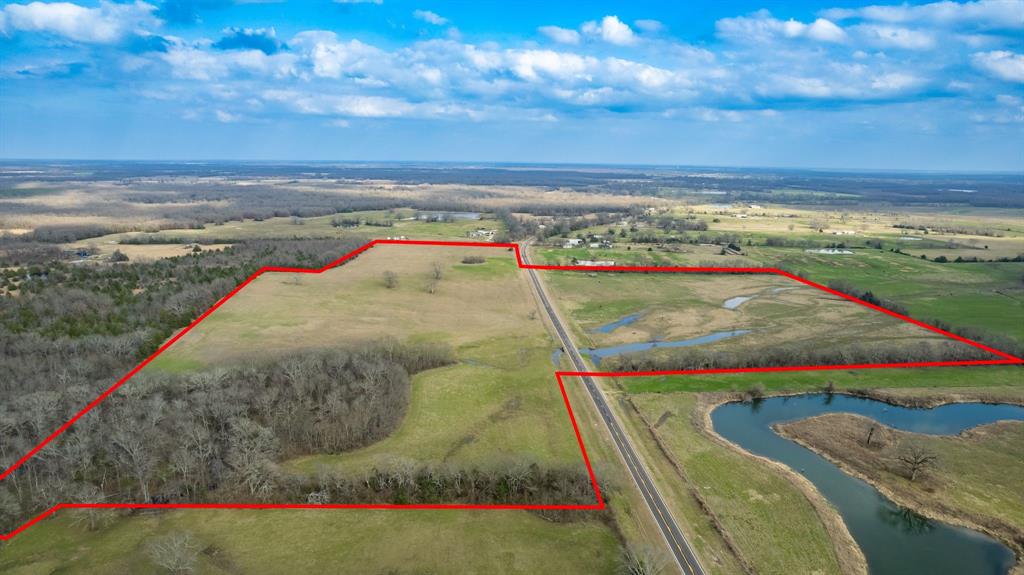This stunning 74-acre property offers a mix of beautiful pastureland and lightly wooded areas, making it ideal for hunting, livestock, or a peaceful country retreat. With road frontage on both CR 15700 and FM 1498, with almost a half mile of frontage on both sides of FM 1498, makes it's accessibility a major plus. Whether you are  looking to build, farm, or enjoy the outdoors, this versatile property has endless potential.