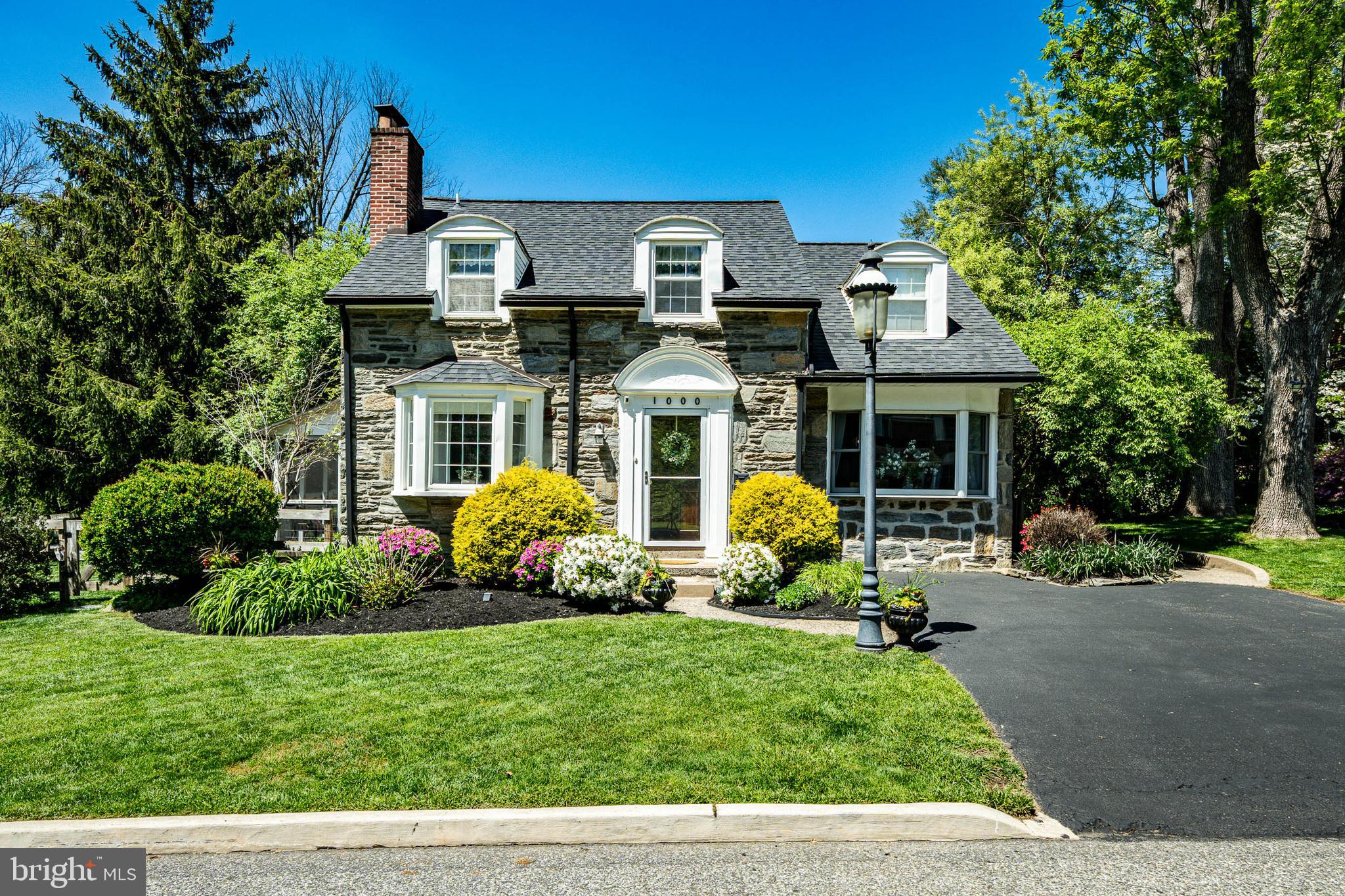Welcome to 1000 Carroll Rd, a charming 3-bedroom, 2.5-bathroom Cape Cod nestled in Carroll Park neighborhood in the highly sought-after Haverford Township School District. Boasting timeless curb appeal, meticulous hardscaping, and exceptional privacy, this beautiful home offers the perfect blend of character, comfort, and modern updates. Step inside to a bright and inviting main level, complete with all new luxury vinyl plan flooring. To your left is the living room, where abundant natural light pours through the windows and a cozy gas fireplace creates the perfect gathering space. The open-concept main level flows seamlessly into the dining area, featuring access to the enclosed rear patio, making indoor-outdoor entertaining effortless. The heart of the home is the beautifully updated kitchen, complete with stainless steel appliances, a center island, sleek countertops, stylish modern backsplash, ample cabinetry, generous prep space, and a dedicated coffee bar area. Just off the kitchen, the formal dining room is enhanced by a contemporary chandelier, providing an elegant setting for meals and special occasions. A convenient powder room completes the main level. Head upstairs, where custom wall moulding encompasses the stairwell and upstairs landing.  Retreat to the spacious primary suite, offering plush carpeting, a walk-in closet, and a private ensuite bathroom with a glass-door, tile-surround shower. Two additional generously sized bedrooms are located down the hall and share easy access to a full hall bathroom. The finished basement provides valuable additional living space with endless possibilities, whether you're envisioning an entertainment room, play area, home gym, office, or a combination of everything! Storage is provided throughout the 2 large closets, and under-stair storage. Step outside through the screened-in patio to discover the fully fenced backyard. With plenty of room for children and pets to play, this private outdoor oasis is ideal for relaxing, unwinding after a long day, or hosting summer barbecues with family and friends. Carroll Park is right across the street! You are also just minutes from public transportation (including Penfield Train Station which is within walking distance for an easy commute to the city!), local shopping, dining, and major commuting routes. This exceptional home offers the lifestyle you've been waiting for—welcome home!