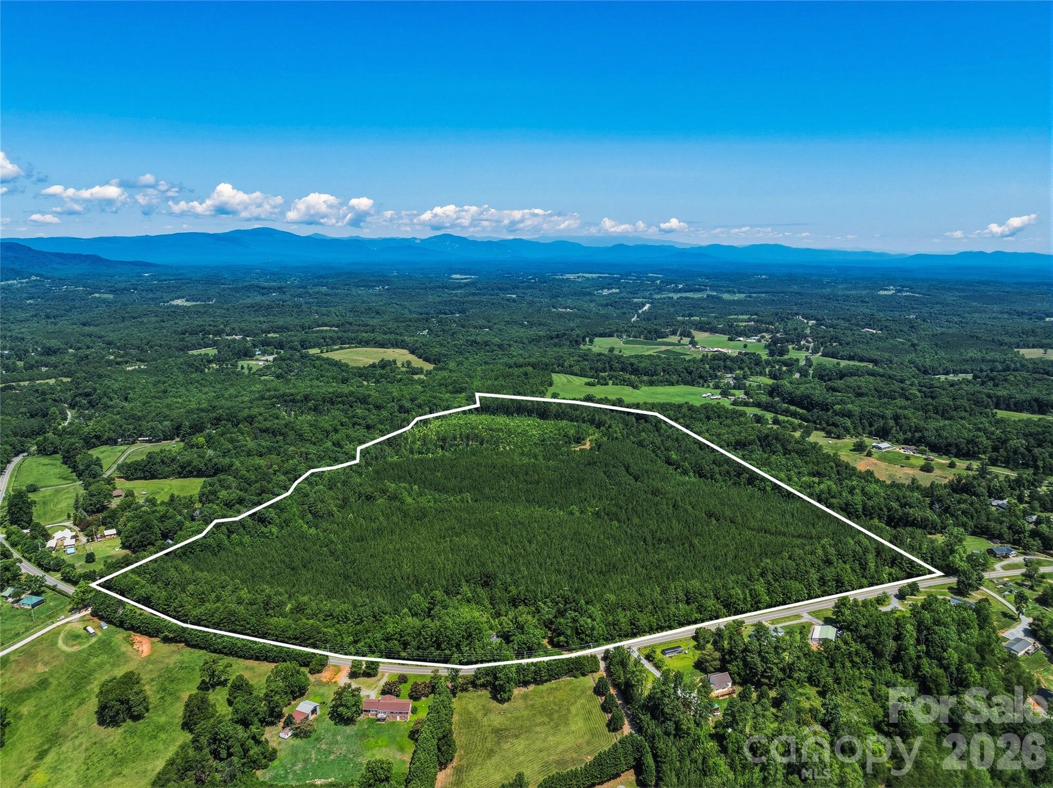 Loblolly Farm presents an extraordinary opportunity to own one of the Southeast's most significant land offerings. Encompassing approximately 83.73 unrestricted acres in the heart of Tryon's renowned equestrian country, this remarkable legacy property offers exceptional beauty, privacy, and limitless possibilities just 5.9 miles from Tryon International Equestrian Center.Rolling pastures, mature hardwood forests, and breathtaking Blue Ridge Mountain views create an inspiring landscape equally suited for a world-class equestrian estate, private family retreat, luxury residential enclave, conservation property, or long-term investment. Multiple exceptional building sites provide the opportunity to create a truly extraordinary destination while preserving the property's natural beauty.Recognizing the property's extraordinary potential, acclaimed architect Lane Pettigrew, renowned for his innovative, environmentally sensitive, and timeless designs, has envisioned a spectacular equestrian estate specifically for Loblolly Farm. His conceptual master plan showcases the remarkable possibilities for creating one of the premier private sporting estates in the Southeast. With extensive road frontage, abundant water resources, gently rolling topography, and exceptional privacy, Loblolly Farm combines the rare qualities that sophisticated buyers seek but seldom find in a single offering. The property's scale and flexibility provide remarkable optionality for future generations while offering immediate enjoyment in one of the Carolinas' most sought-after lifestyle destinations.Ideally positioned just minutes from Tryon International Equestrian Center, FENCE, the Foothills Equestrian Trail System, charming downtown Tryon, Columbus, Landrum, and convenient access to Greenville, Spartanburg, and Asheville, Loblolly Farm offers the perfect balance of seclusion and accessibility. Whether your vision is an iconic equestrian estate, a private family compound, a conservation legacy, or an exceptional land investment, opportunities of this scale, in this location, and of this quality are increasingly rare.A once-in-a-generation offering where extraordinary natural beauty, architectural vision, and enduring legacy come together to create one of the finest land offerings in the Carolina Foothills.