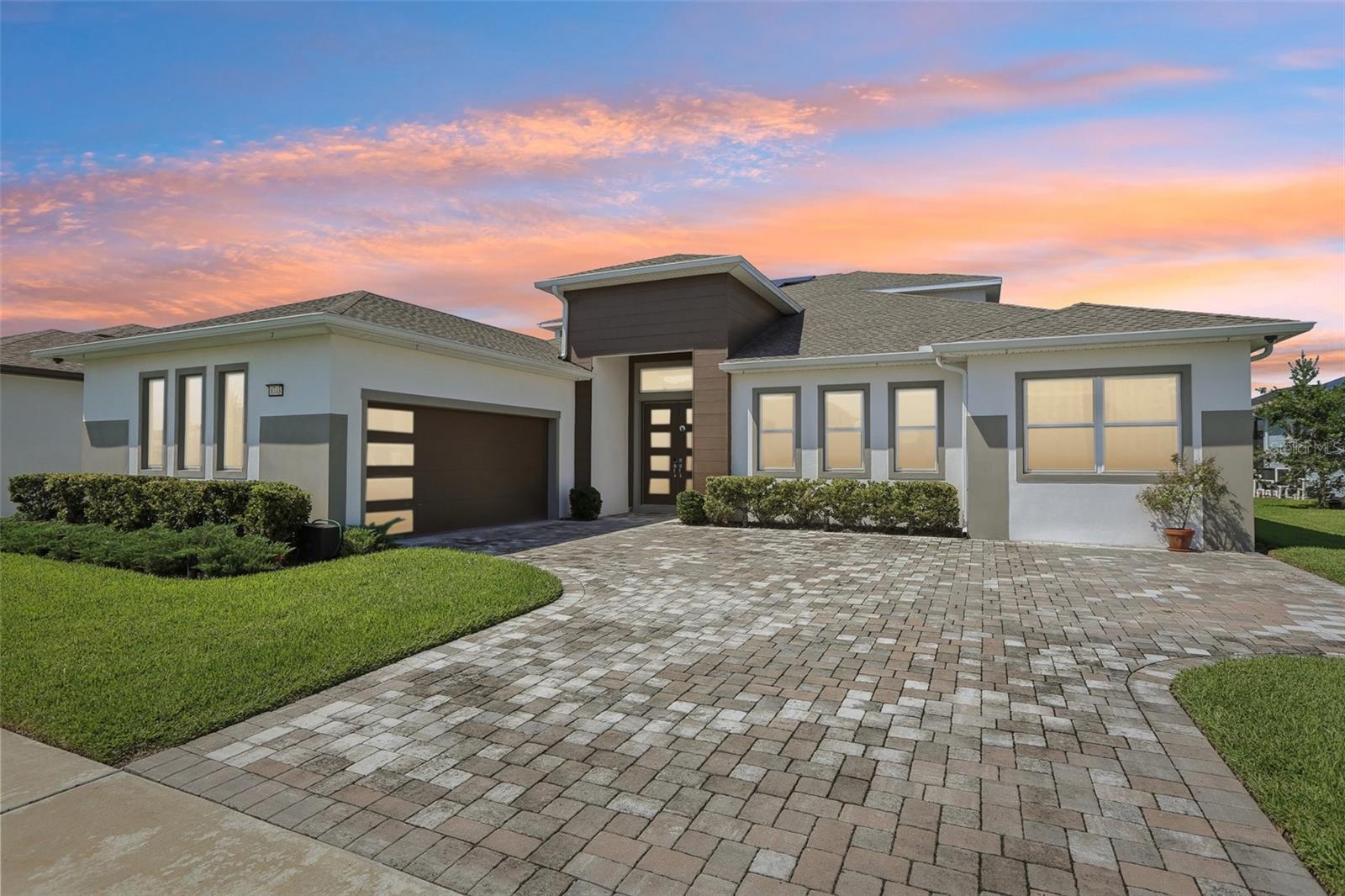 One or more photo(s) has been virtually staged. Seller very motivated!!!! STUNNING WATERFRONT HOME in exclusive gated community! This exceptional 6BR/4BA residence sits on one of the most desirable water-view lots in this 80-home enclave. Open floor plan showcases a gourmet kitchen with upgraded Thermador appliances (range, oven, microwave, dishwasher), stone counters, wall oven, extended cabinetry with coffee/wine station, and buffet bar perfect for entertaining.First-floor primary suite features water views, a large walk-in closet, and a spa-like ensuite with dual sinks and a huge walk-in shower. Three additional bedrooms with walk-in closets are also on the main level. BONUS: Private in-law suite with kitchenette - perfect for multi-generational living or rental income.Upstairs loft connects two more bedrooms and a bath, plus a media room with a projector screen and balcony overlooking nature with no backyard neighbors.PREMIUM UPGRADES: 29KW solar panels, whole-home water softener/distilled water system, Cat 6 cabling throughout, 30 premium speakers with 3 subwoofers, mosquito mist system, custom cabinetry in mud room/laundry/office, luxury vinyl plank main level with carpet upstairs, complete gutter system, garage with Floortex Polyaspartic coating, overhead storage racks, slat walls, and bike racks. Home warranty through 2027 included.Covered paver patio with serene water views. VASTU COMPLIANT: Thoughtfully oriented to promote well-being, prosperity, and harmonious living. The Epperson community offers lagoon access with 7 acres of crystal-clear water, a swim-up bar, kayaking, paddleboarding, cabanas, live music, golf cart parades, top-rated schools, and included high-speed internet. Minutes from shopping/dining, 35 minutes to Tampa International Airport. KEY FEATURES*Gated waterfront community*Open floor plan*Gourmet kitchen with Thermador appliances*First floor primary suite*In-law suite with kitchenette*Media room with projector*29KW owned solar system*Premium sound system (30 speakers/3 subs)*Whole-home water treatment*Professional garage organization system*No backyard neighbors*Resort-style community amenities*Home warranty included through 2027*- See attached floor plans and documents.