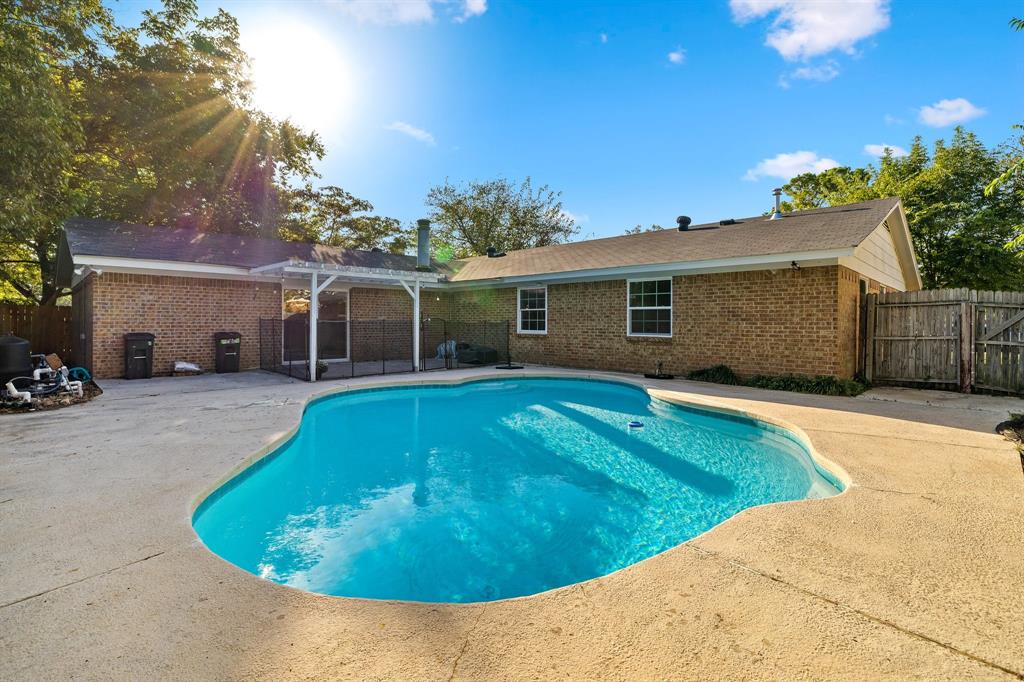 Back on market! Unfortunately the buyer lost his job, but the new roof is beautiful and home is ready with great equity opportunities for new buyer! POOL IN TEXAS!! I think, YES! The home features two spacious living areas—one with a cozy fireplace and built-in shelves near the kitchen, and another ideal for entertaining with a second fireplace, dry bar, and access to the pool. The pool, with new plaster, tile and filter, offers a pergola just off the living area and a generous deck. Recently updated, this charming 3-bedroom, 2-bathroom home shines with fresh, neutral tones throughout. Designer lighting and light-colored LVP flooring flow seamlessly through every room, enhancing the bright, open feel. New windows flood the home with natural light. The dining room at the front can flex as a home office. Conveniently located near Highways 287, 820, and I-35W, this home blends tranquil living with easy access to modern amenities.

Special Financing Incentive Available! Seller is offering a 2-1 Temporary Rate Buydown to lower the buyer’s interest rate and payment in the first two years — saving the buyer thousands.