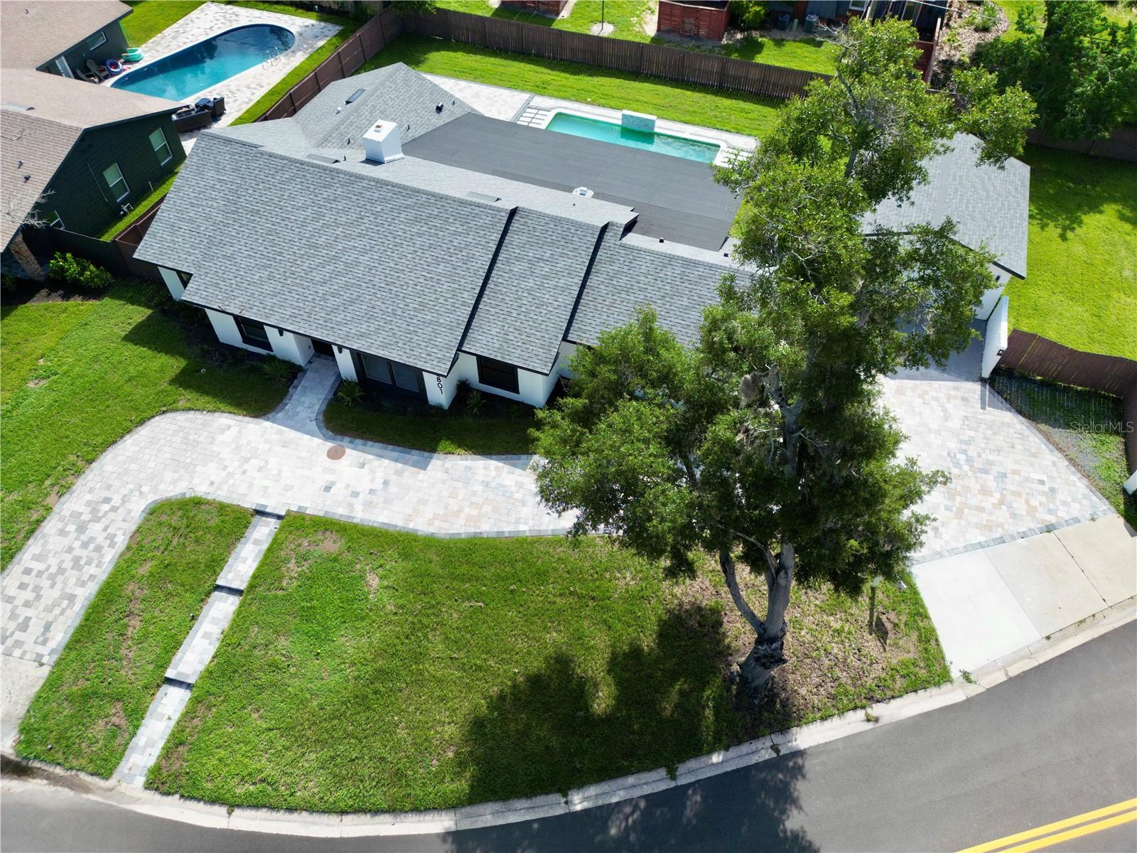 Welcome to Dommerich Hills, where modern style meets everyday comfort. This beautifully renovated home offers the freedom of **NO HOA** and has been thoughtfully updated from top to bottom. From the paver driveway and elegant double-door entry to the bright, open-concept interior, every detail has been designed to make you feel at home.The heart of the home is a stunning chef-inspired kitchen featuring sleek custom cabinetry, stainless steel appliances, and a striking waterfall island with custom wood accents,perfect for entertaining family and friends. The spa like bathrooms has glass-enclosed showers, contemporary fixtures, and designer finishes that create a relaxing retreat.Step outside and discover your own private Florida oasis. A covered lanai overlooks the sparkling pool and expansive paver patio, creating the ideal space for outdoor dining, weekend gatherings, or simply unwinding in the sunshine.Conveniently located just minutes from major highways, shopping, dining, and entertainment, this beautifully renovated home combines modern design with everyday functionality. Schedule your private showing today and experience everything this exceptional property.