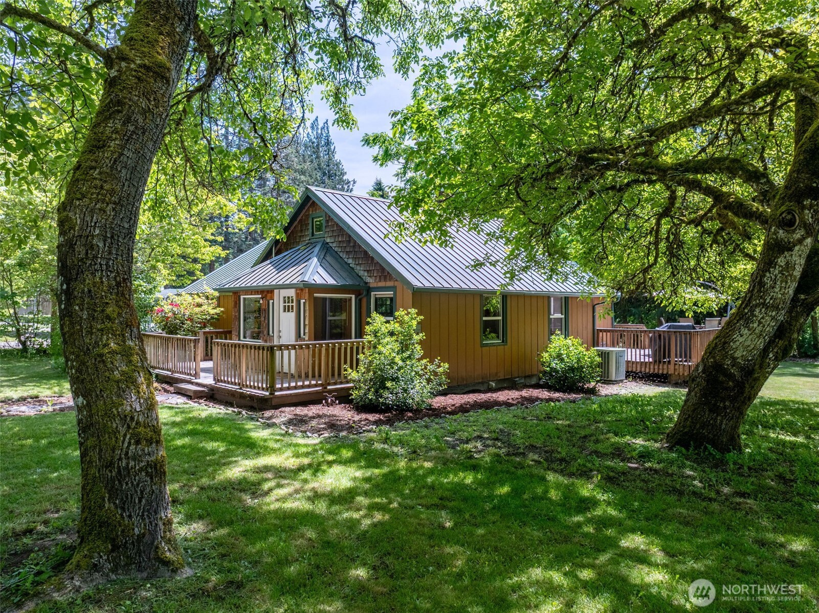 Tucked away just outside the historic mountain community of Packwood, this charming 1,558 sq ft cottage offers the perfect blend of comfort, privacy, and year-round recreation. Featuring 3 bedrooms, 1 full bath plus a 3/4 bath, front and back decks, and an enclosed porch, the home is full of warmth and character, surrounded by mature landscaping and towering old-growth trees on a beautifully maintained, low-maintenance 0.89-acre lot on sought after Silverbrook Road.    Ideally suited as a full-time residence, this property is a dream basecamp for outdoor enthusiasts. Just minutes from Mount Rainier National Park, about 30 minutes from White Pass Ski Area, and bordering Gifford Pinchot National Forest, adventure is always within reach, offering hiking, skiing, snowboarding, snowshoeing, fishing, kayaking, ATV riding, and more. Less than 11 miles from downtown Packwood, you’ll enjoy easy access to local restaurants, breweries, and small-town charm while still feeling worlds away in your own peaceful mountain retreat.    The property also offers excellent potential as a vacation getaway or short-term rental investment, making it a versatile opportunity in one of the Pacific Northwest’s most sought-after recreation areas. Buyer to verify all information and conduct any inspections to their own satisfaction. This property is *NOT* in a flood zone, please have your broker verify this on the flood maps.