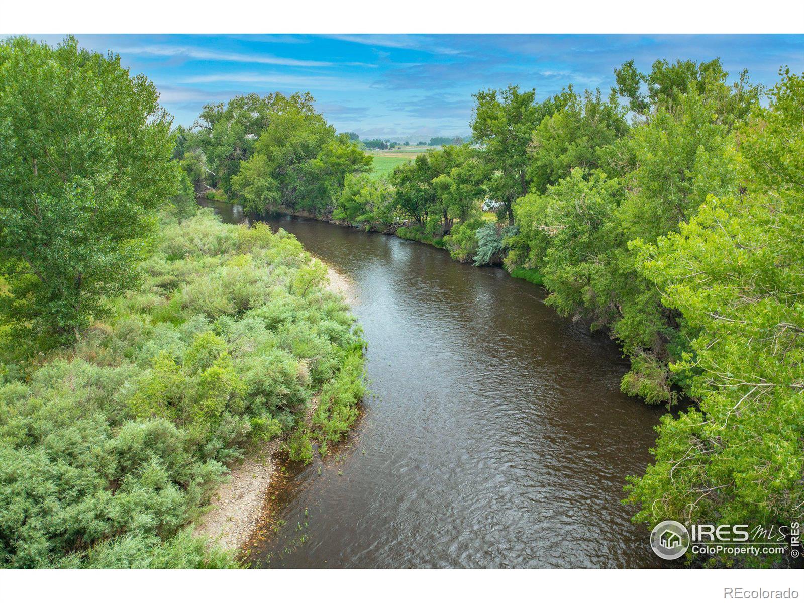Discover an exceptional opportunity to own prime land with the Poudre river running through it in a rapidly developing area! This incredible 37.07 acre parcel features 11 to 17 acres of buildable space for a variety of uses. This is your chance to secure a rare and valuable piece of land in a prime location if you are looking to develop commercial, residential, or a mixed-use project. Dont miss out! The sale may include art sculptures that would continue to be part of the area's history enhancing the property's distinct character. Positioned at the Gateway to Timnath, at the I-25 and Harmony corridor, this land is at the heart of a growing area situated in a thriving commercial hub, benefiting from close proximity to major retail and dining establishments, including Costco, Walmart and others.The area is a bustling center of activity, providing a steady flow of traffic and robust local commerce-making this an ideal location for both current use and future development.Key features include but are not limited to Riverfront Access. Enjoy the serene river that runs through the property, offering stunning views and a natural backdrop.The non-buildable portions of the land make it an ideal location for thoughtful development.A scenic trail runs along the eastern edge of the property, connecting to Gateway Pond to the north and reaching established neighborhoods to the southeast, adding incredible connectivity and charm.The land is being sold "as-is." The existing structures are not considered habitable. No showings of interior of buildings until letter of intent or contract in place. All property showings require the listing agent(s) to be present for access. This is your chance to secure a rare and valuable piece of land in a prime location. Contact us today to schedule a private showing and explore the possibilities! Serious and qualified buyers only please. Zoned AG but is in the Timnath Growth area; upon sale the property has to be annexed into Timnath.