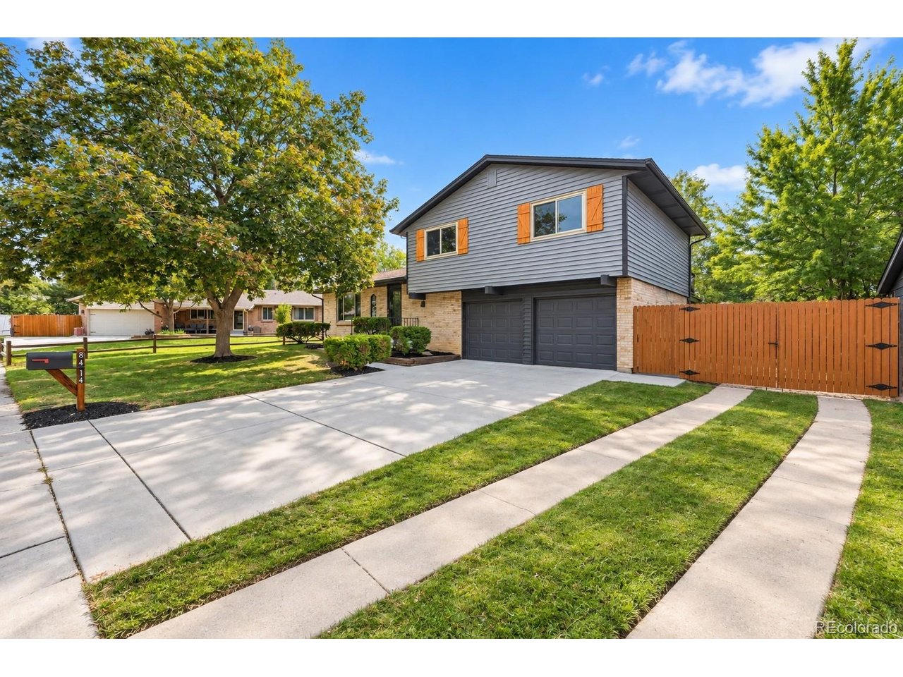 Welcome to 8414 Kendall Ct. located on a cul-de-sac is a beautifully remodeled home in Arvada's popular Lake Arbor neighborhood! This established community is known for its mature trees, recreational opportunities, and convenient location. Little Elementary is approximately a five-minute walk away, Lake Arbor Golf Club is nearby, and Lake Arbor Park with its lake, trails, playground, and open green space is about 10 minutes from home. Inside, the open-concept layout creates a bright and inviting connection between the kitchen, dining, and living areas. The remodeled kitchen features white cabinetry, warm wood countertops, statement tile, floating shelves, stainless-steel appliances, and a custom island with modern wood detailing. Updated flooring, recessed lighting, dramatic black accents, and beautifully refreshed bathrooms complete the home's polished design. The primary suite features a private balcony overlooking the backyard, while the large lawn, mature trees, covered outdoor space, and multiple patio areas offer plenty of room to relax, entertain, garden, or play. With extensive updates, a spacious backyard, no HOA fees, and convenient access to Little Elementary, Lake Arbor Golf Club, Lake Arbor Park, shopping, dining, and major roadways, this home offers the location and lifestyle that make Lake Arbor so desirable.