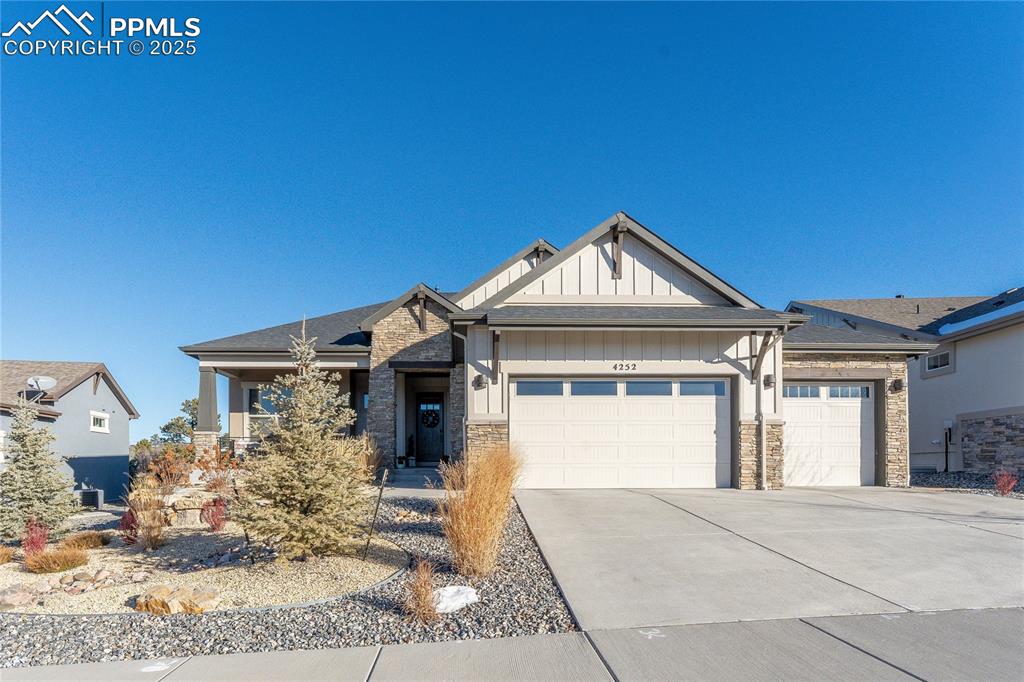 Welcome to this stunning Goetzmann Custom Home featuring the highly sought-after Sterling design, showcasing exceptional craftsmanship and high-end finishes throughout. Step into the expansive Great Room, where soaring beamed ceilings and abundant natural light create a truly breathtaking atmosphere—ideal for both intimate evenings and lively gatherings. The space flows effortlessly into the gourmet kitchen, a chef’s dream anchored by a professional GE Monogram 48" range with custom hood and pot filler. An oversized granite island, beautifully painted cabinetry, and two walk-in pantries complete this impressive culinary space. Additional features include rich hardwood flooring, 8' alder doors, and meticulous detailing in every room. Retreat to the luxurious primary suite complete with heated floors, an oversized walk-in shower, freestanding tub, generous walk-in closet, and a spa-inspired 5-piece bath. The main level also offers a private junior suite and a dedicated study with French doors. Descend to the beautifully finished lower level, designed for endless entertainment. A generous recreation room with wet bar, inviting lounge area, and a striking stone fireplace offers the perfect setting for relaxed get-togethers. Elegantly concealed behind a door, you’ll find a dedicated home theater equipped with a massive 110" screen and full 7-speaker surround sound—your personal haven for movie nights, sports, and immersive entertainment. The fully insulated, drywalled, textured, and painted garage adds both comfort and functionality. Located in a vibrant master-planned community offering a heated outdoor pool, fitness center, clubhouse, playgrounds, and miles of scenic hiking and biking trails. Enjoy the convenience of being just minutes from shopping and dining. This home is truly a custom masterpiece with designer touches throughout—an absolute must-see.