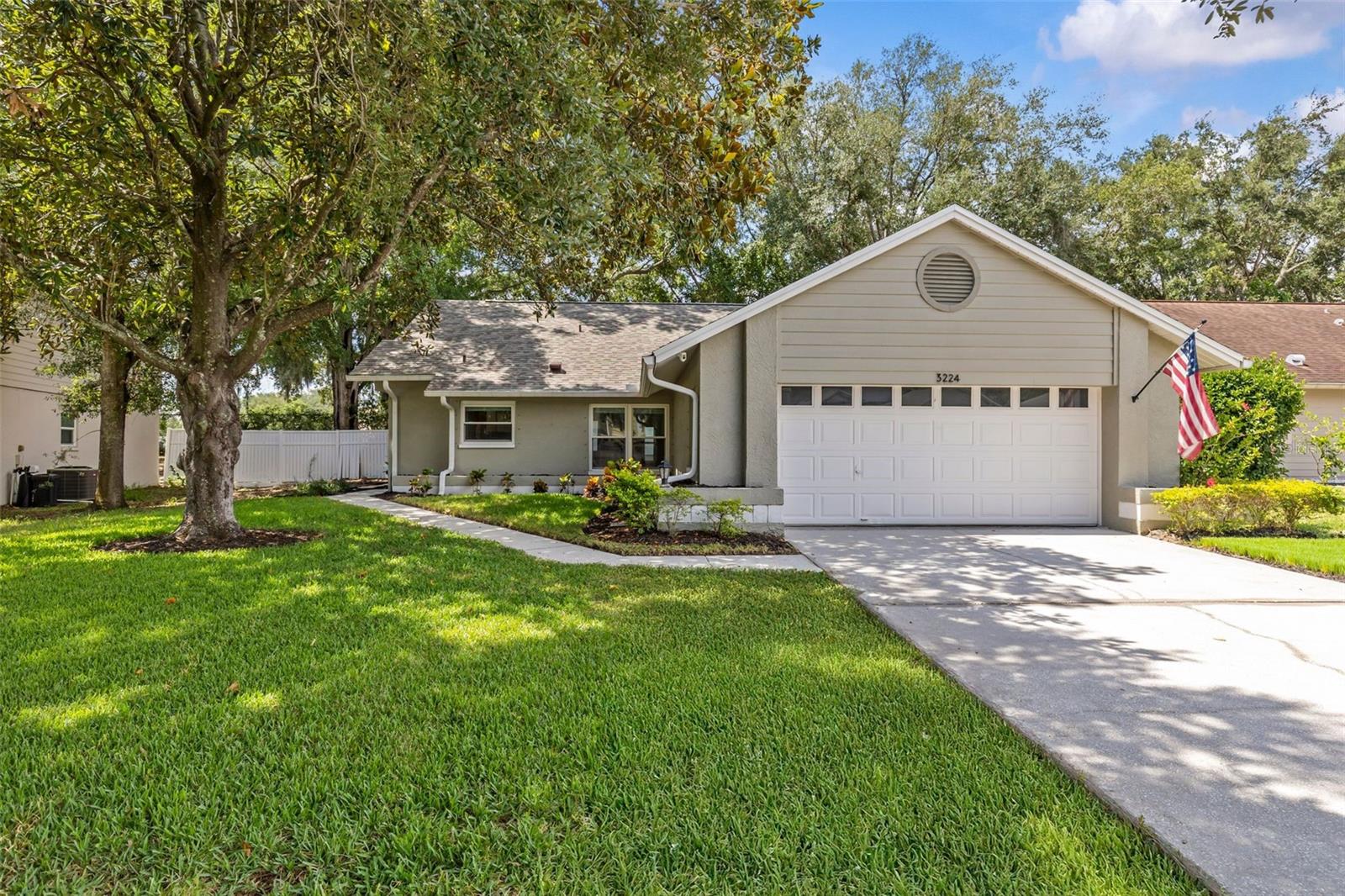 Virtually Staged. Nestled in the sought-after Hamlet at Bentley Park community, this beautifully maintained, move-in-ready 3-bedroom, 2-bathroom home with a 2-car garage offers the perfect blend of comfort, style, and peace of mind. Located in Flood Zone X and a NON-EVACUATION ZONE, this home provides additional peace of mind. Major improvements have already been completed, including a BRAND NEW ROOF installed in May 2026, a 2023 A/C system, a beautifully remodeled primary bathroom completed in 2023, hurricane screens for windows, updated interior windows, and a reverse osmosis water filtration system at the wet bar. Inside, soaring cathedral ceilings create a bright and spacious atmosphere filled with natural light. Step outside to enjoy the screened lanai, perfect for morning coffee, outdoor dining, or relaxing year-round. The backyard fire pit area creates an inviting setting for gathering with family and friends and enjoying Florida's cooler evenings. Residents of Bentley Park enjoy access to a community pool, tennis courts, and a park. Located within Palm Harbor's highly rated school district and just minutes from Gulf beaches, shopping, dining, parks, and everyday conveniences, this home offers an exceptional Florida lifestyle in one of the area's most desirable communities. Don't miss your opportunity to own this beautiful Palm Harbor home with major improvements already completed.