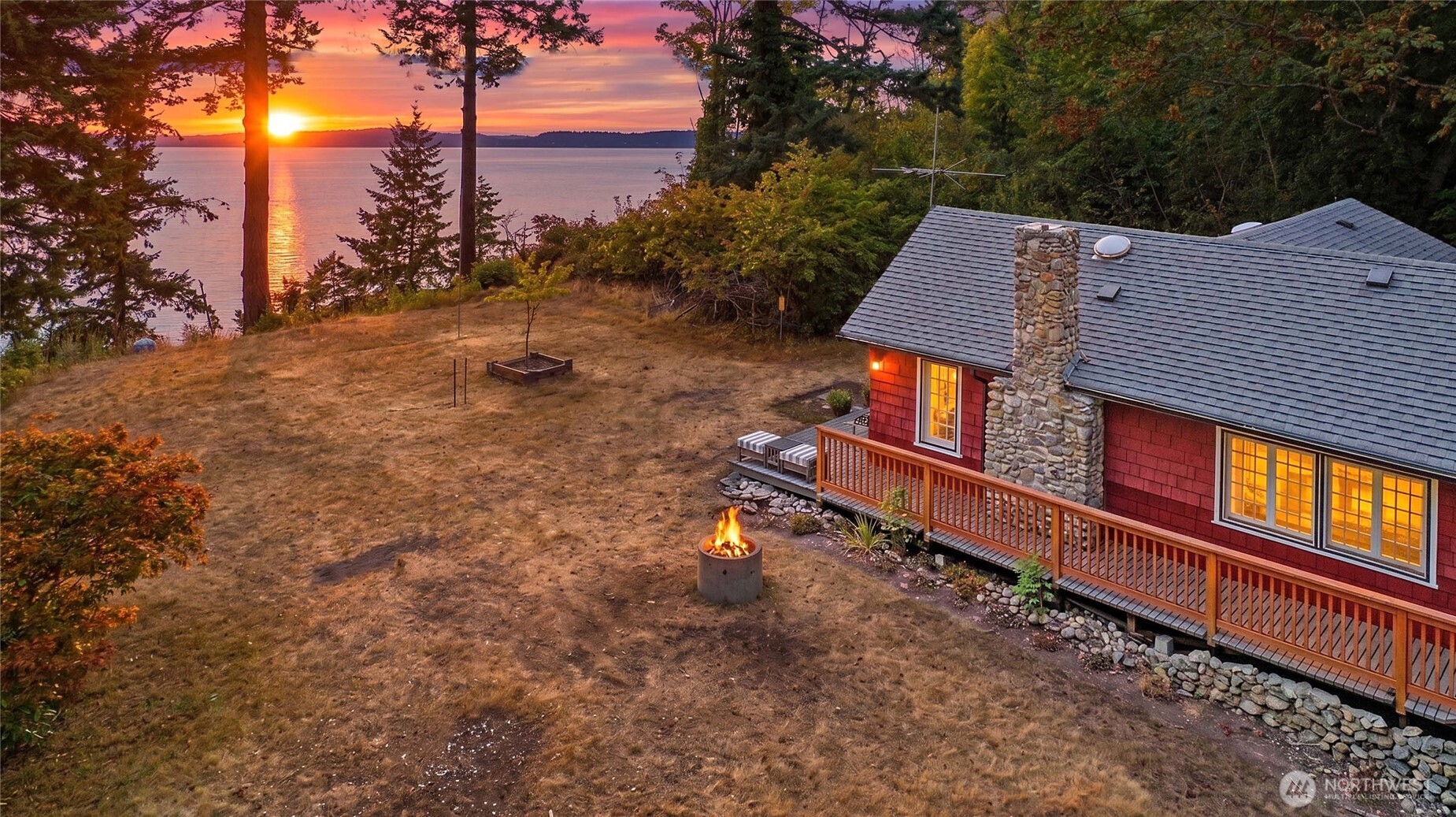 Private Stanwood acreage tucked down a long-wooded drive with high-bank waterfront, sweeping water views, and colorful sunsets. The existing 1920s 1BR + den home is a significant fixer, offering potential for an extensive renovation or future new build. Newer deck and railing take advantage of the setting. Large, detached shop with power provide space for storage, equipment, or projects. A unique opportunity to create a custom retreat in a peaceful, scenic location. No beach access or tideland rights. Buyer to verify building, permitting, and development potential.