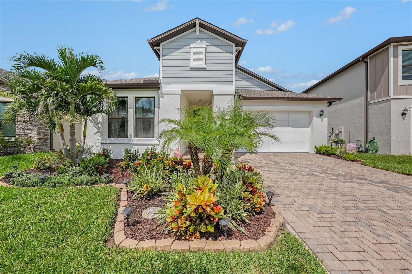 Move-in ready and built in 2022! This beautiful waterfront home in Bryant Square offers 3 bedrooms, 2 baths, a 2-car garage and 1,873 sq. ft. of bright, open living space. Enjoy a modern kitchen overlooking the family room, smart-home features, gas cooking and a covered lanai. The fenced backyard delivers peaceful pond views and unforgettable sunsets. Resort-style pools, parks, playgrounds and trails complete the lifestyle. Schedule your private showing today!