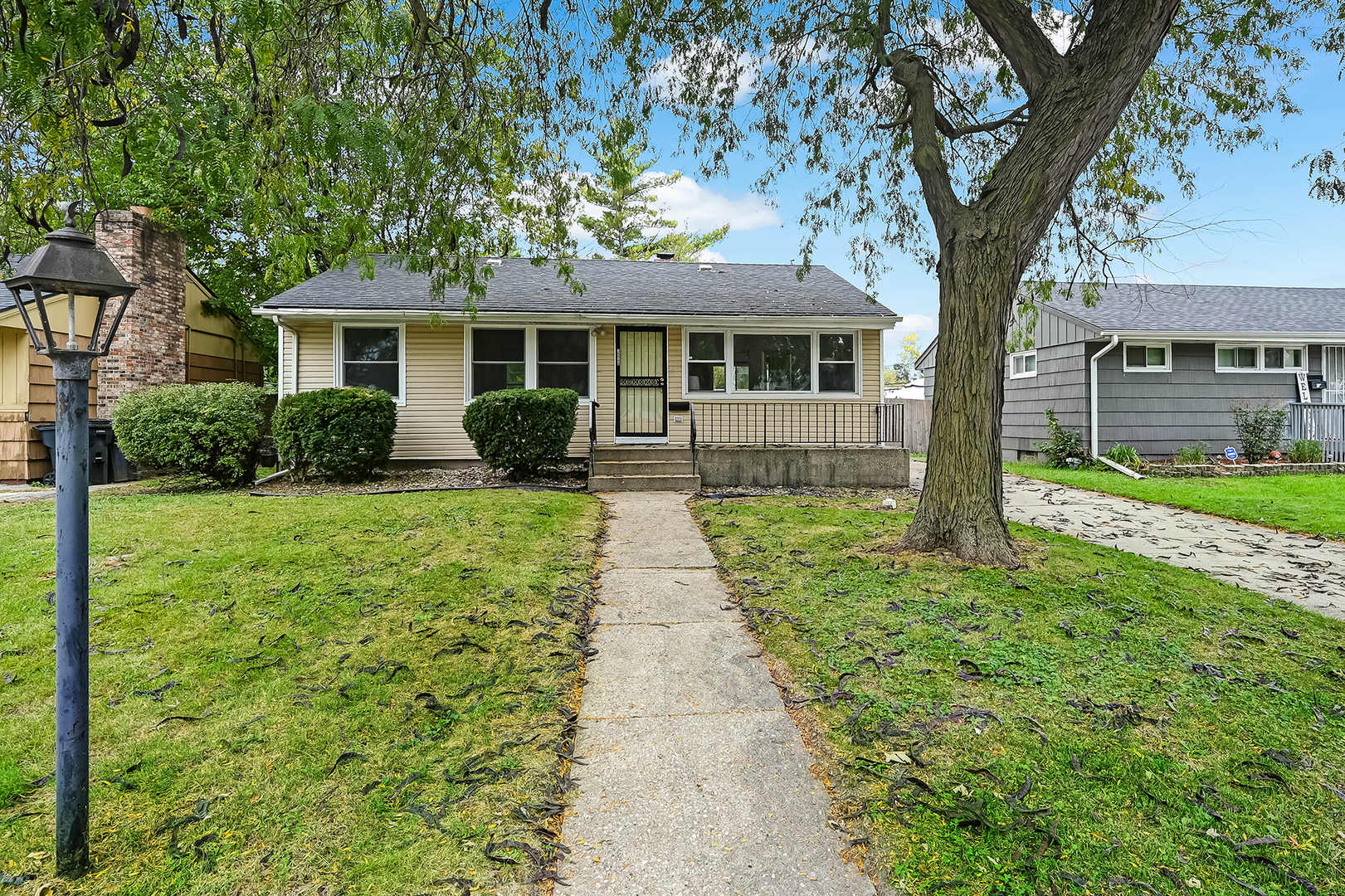 Welcome to this bright and inviting ranch-style home in South Holland, perfectly suited for those looking for a fresh start or a savvy investment opportunity. The moment you step inside, you're greeted by the warmth of original hardwood floors and a crisp, neutral color palette that flows throughout the entire house. The heart of the home is the spacious eat-in kitchen, which feels incredibly open thanks to an abundance of natural light. It features brand-new vinyl plank flooring, a convenient pantry closet, and a full suite of stainless steel appliances. The bathroom has been tastefully remodeled, ensuring this home is truly move-in ready. Downstairs, the full, unfinished basement is impressively clean and dry-a blank canvas for storage or future projects, already equipped with laundry hookups and a utility sink. Outside, the large, fenced rear yard offers plenty of space for outdoor activities and gatherings. Positioned in a convenient location with easy access to local dining, shopping, parks, and major expressways, this property offers both comfort and potential. Whether you are looking for a primary residence or a turn-key addition to your rental portfolio, this South Holland gem is a must-see.