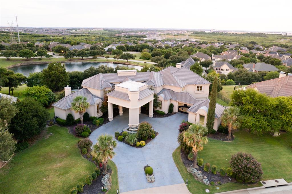 Guard-gated Kings Gate with security. This soft contemporary showcases NE facing pond and skyline views and a layout built for real life with primary suite and guest suite on main, media room, two studies, and seamless indoor-outdoor flow via new accordion doors to the covered living area and summer kitchen. Thoughtful renovations layer warm woods and sleek stone with a chef’s kitchen of upscale pro-grade appliances and generous storage. The primary bath adds a steam shower and heated floors for spa-level comfort. Upstairs you’ll find a junior suite, an additional ensuite bedroom, and two bedrooms with a Jack-and-Jill, plus two game rooms and a dedicated exercise room. Multiple balconies frame the view. Outside: negative edge pool & spa, grassy play yard, vegetable garden, and a flat pad perfect for basketball sport court. Four car garage. Media room equipment and furnishings available, ask agent. A private, polished retreat minutes from dining, schools, and services.