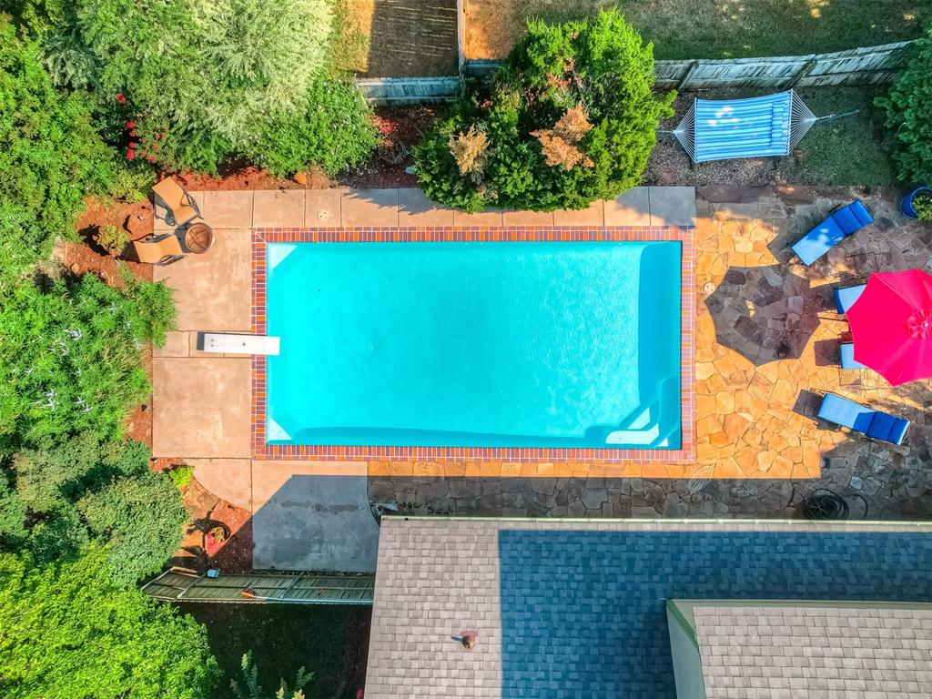 **OPEN HOUSE Sunday August 17th 2:00-4:00** Oaktree Park with a POOL!! Located on a corner lot, this spacious 4-bedroom, 2.5-bath home offers comfort, style, and functionality. Recent upgrades (May 2025) include a new roof, gutters, siding, garage door, and new carpet downstairs. The main level features a master suite, a cozy living room with brick fireplace with a hearth, a built-in wet bar, a half bath, and both casual and formal dining areas. The kitchen includes an island, double ovens, ample cabinet space, and a pantry—ideal for everyday living and entertaining. Upstairs, you'll find two bedrooms with a shared Jack & Jill bath, plus a versatile fourth bedroom currently used as a theater/bonus room. The true gem of this home is the gorgeous backyard retreat, featuring a recently replastered and resealed pool that’s 10 feet deep—ready for summer fun! Additional driveway parking for a third car, or RV parking! Please note, there is a functioning window behind the projector screen in the 4th bedroom/bonus room. This home is not part of the HOA, buyer has the option to opt-in. The neighborhood amenities include a pool, tennis courts, and fishing ponds. Schools: Cross Timers Elementary, Cheyenne Middle School, Edmond North High School. Buyer to verify all info.