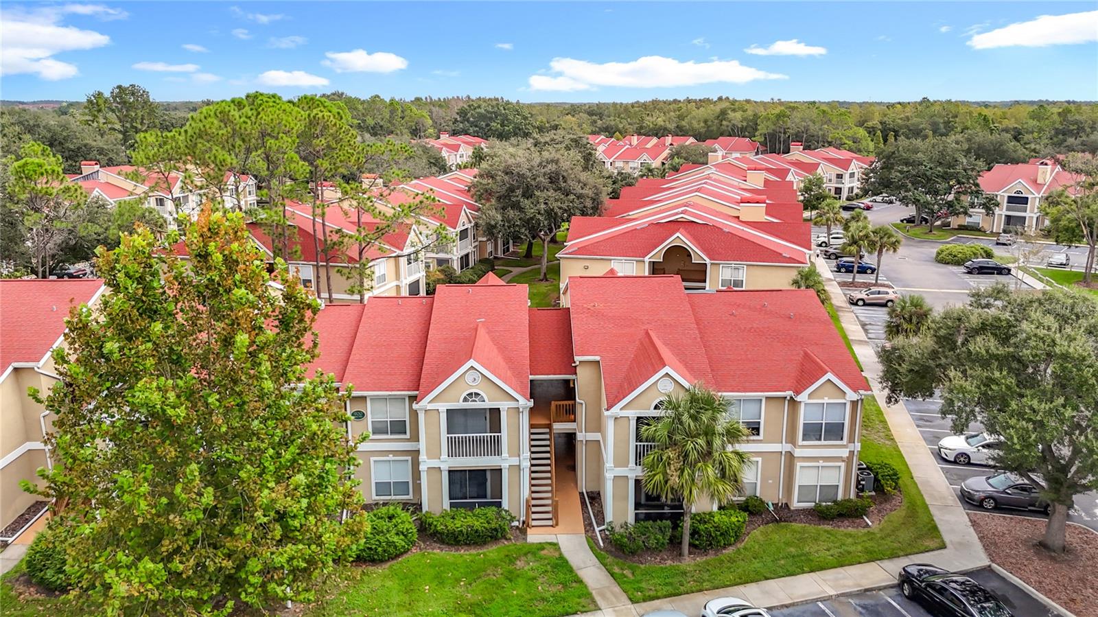Stepping into this beautifully maintained first-floor condo located in The Highlands, you'll be immediately drawn to the spacious open floor plan and the wood-look luxury vinyl plank adding warmth throughout the entire home! Your kitchen includes stainless steel appliances, updated glass backsplash, and a convenient breakfast bar that connects to the living room. The oversized living room leads out to a screened patio with a courtyard view, as well as additional outdoor storage. The dining room is large enough for a formal dining table, perfect for dinner parties with family and friends. The primary suite offers a walk-in closet and is directly across from your beautifully renovated bath with dual vanities, granite countertops, jetted spa tub, large linen closet, and tiled walk-in shower. The second bedroom is generous in size and can also serve as a home office. Additional features include an indoor laundry with shelving, water softener, roof (2017), and water heater (2017). Located in the sought-after community of Hunter's Green, you'll enjoy the benefits and security of the 24/7 manned gates, exterior building maintenance, landscaping, pool access, clubhouse, fitness center, playgrounds, jogging trails, tennis courts, and optional golf membership. Conveniently located in New Tampa just minutes from I-75, USF, Advent Hospital, James A. Haley Veterans Hospital, Moffit, shopping, restaurants, and places of worship.