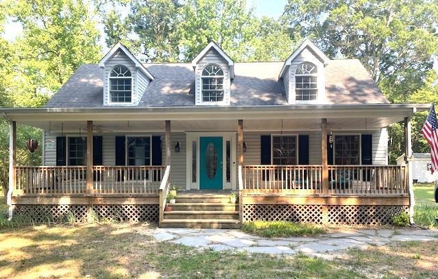 Welcome to this updated 3-bedroom Cape Cod on 2 private acres, perfectly situated just minutes from Cape Charles. First floor primary bedroom with ensuite Freestanding ventless gas fireplace in living room Remodeled kitchen, with quartz countertops and new appliances. Three updated bathrooms with contemporary fixtures and finishes. New carpet upstairs and new luxury vinyl flooring throughout the main level. Tankless water heater  Full front porch with ceiling fans and porch swing. The back deck features a convenient retractable awning. Storage shed and separate workshop  Dedicated boat canopy with water and electricity, making maintenance and wash-down a breeze. Washer and dryer convey along with a Cyclone leaf system which makes fall cleanup effortless.