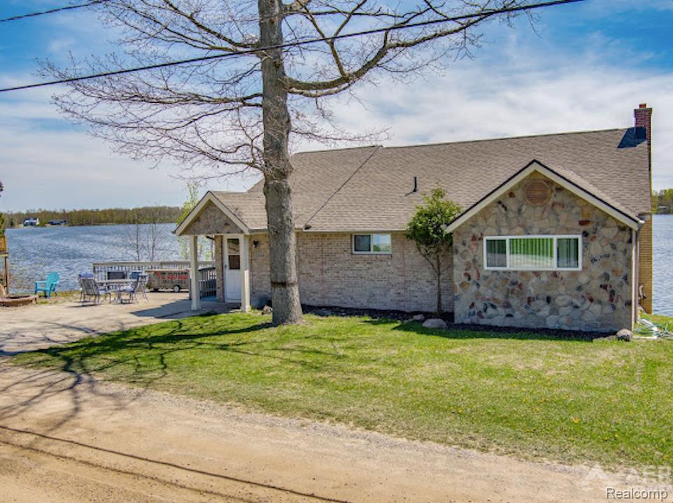 Welcome to your dream lakefront getaway on beautiful, all-sports Hardwood Lake! This charming 3-bedroom, 1-bath bungalow offers stunning water views, 6.63 acres of land, and the perfect blend of relaxation and recreation. Enjoy an open-concept interior with walkout access on both levels—step out onto the balcony from the entry level or head downstairs to a finished walkout basement that leads directly to the lake. With two bedrooms upstairs and one on the main level, there's plenty of space for family and guests. Outside, you’ll find a new seawall installed in 2022, a sandy beach area ideal for lakeside lounging, and a dock for easy water access. A new roof on both the house and the garage ensures peace of mind for years to come. Included with the property is a spacious pole barn with drive-through garage doors, perfect for storing all your lake toys, vehicles, or equipment. The barn opens up to over 6 acres of beautiful land—ideal for nature walks, gardening, or even future expansion. Perfectly situated between East Tawas and West Branch, you're just 30 minutes from either destination, giving you access to dining, shopping, and more—while still enjoying the peace and privacy of lakefront living. Don’t miss this unique opportunity to own a slice of up-north paradise! Sale also includes parcels 009-031-009-45 and parcel 009-300-015-35.