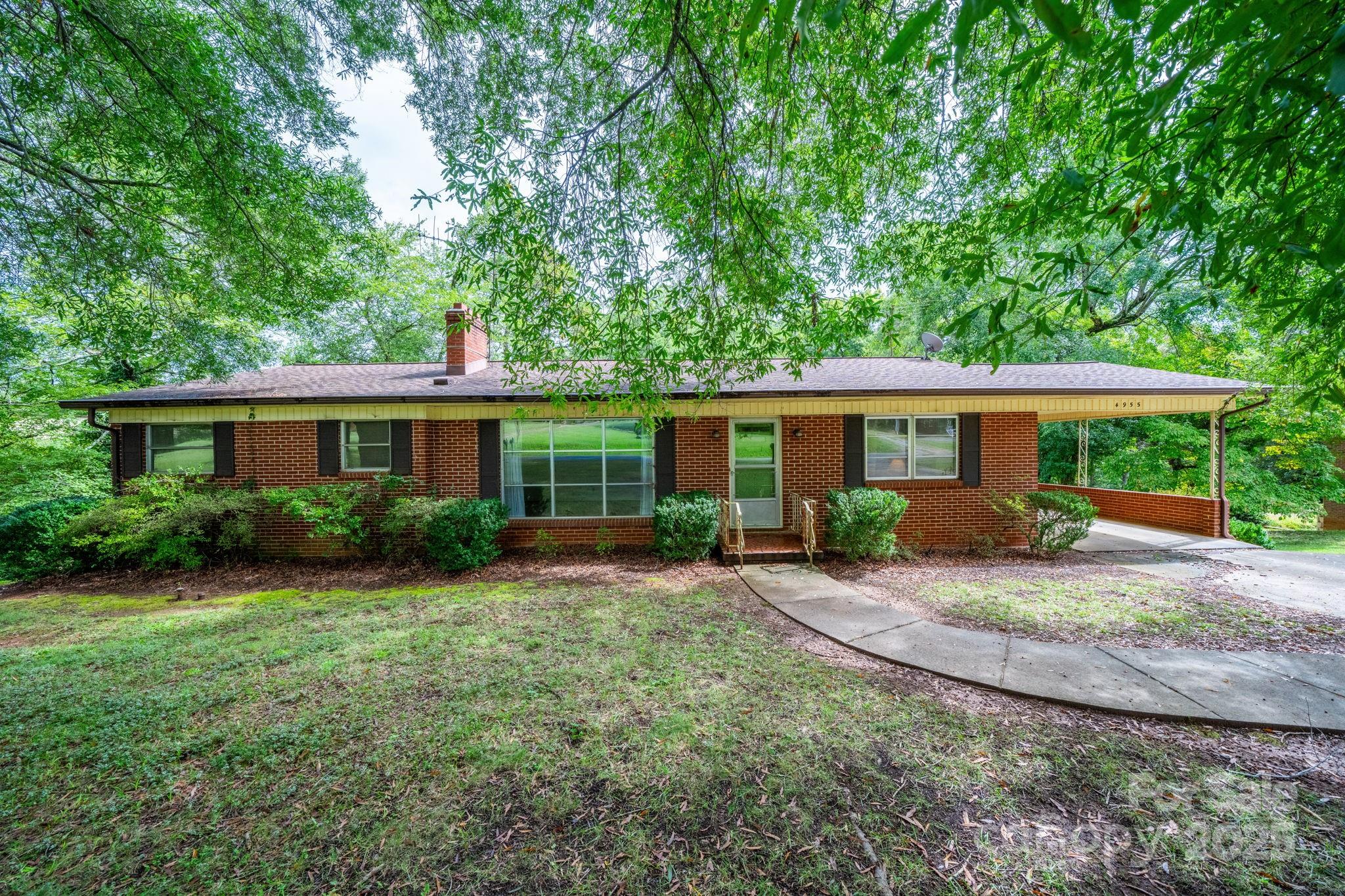 Take a look at this One Owner home! Large 1.5 acre lot!! Conveniently located just off of Hwy 321 with Easy access to Hickory or Lenoir AND right by Lake Hickory!!  NO CITY TAXES!  This 3 Bedroom all brick home features 1720 heated square feet on the main level and a FULL unfinished basement! Formal living room AND den! Living room features hardwood flooring and fireplace.  The full unfinished basement offers loads of potential for future expansion and a single garage door. Great school districts! Updated heat pump/central air in 2022 and architectural shingled roof.